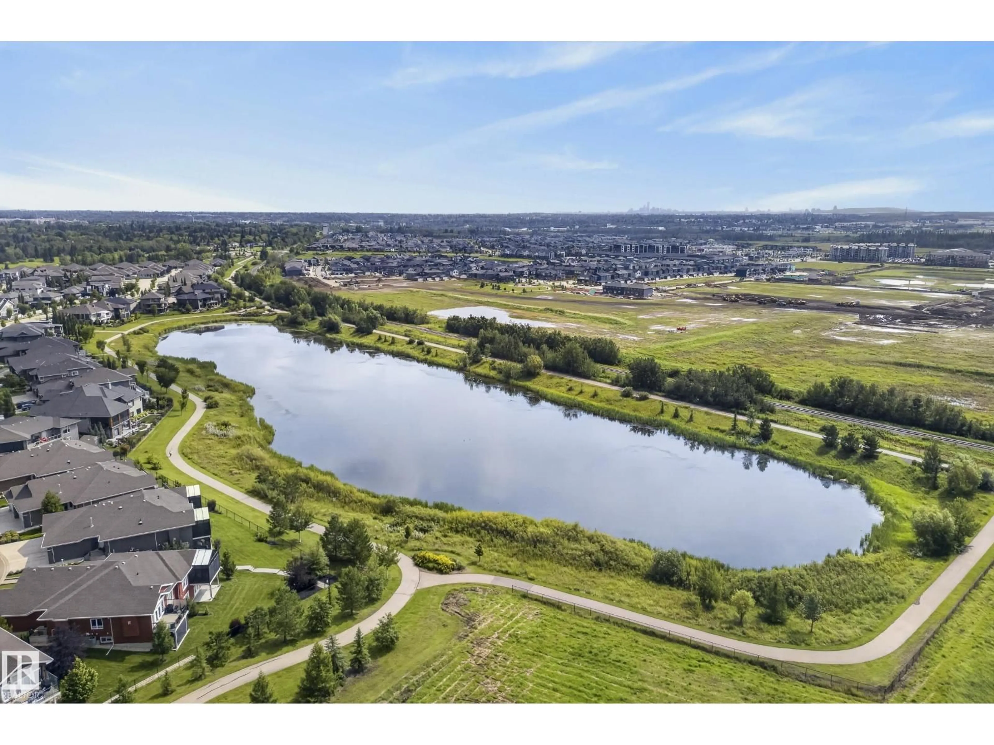 A pic from outside/outdoor area/front of a property/back of a property/a pic from drone, water/lake/river/ocean view for #8 - 88 LACOMBE DR, St. Albert Alberta T8N7N3