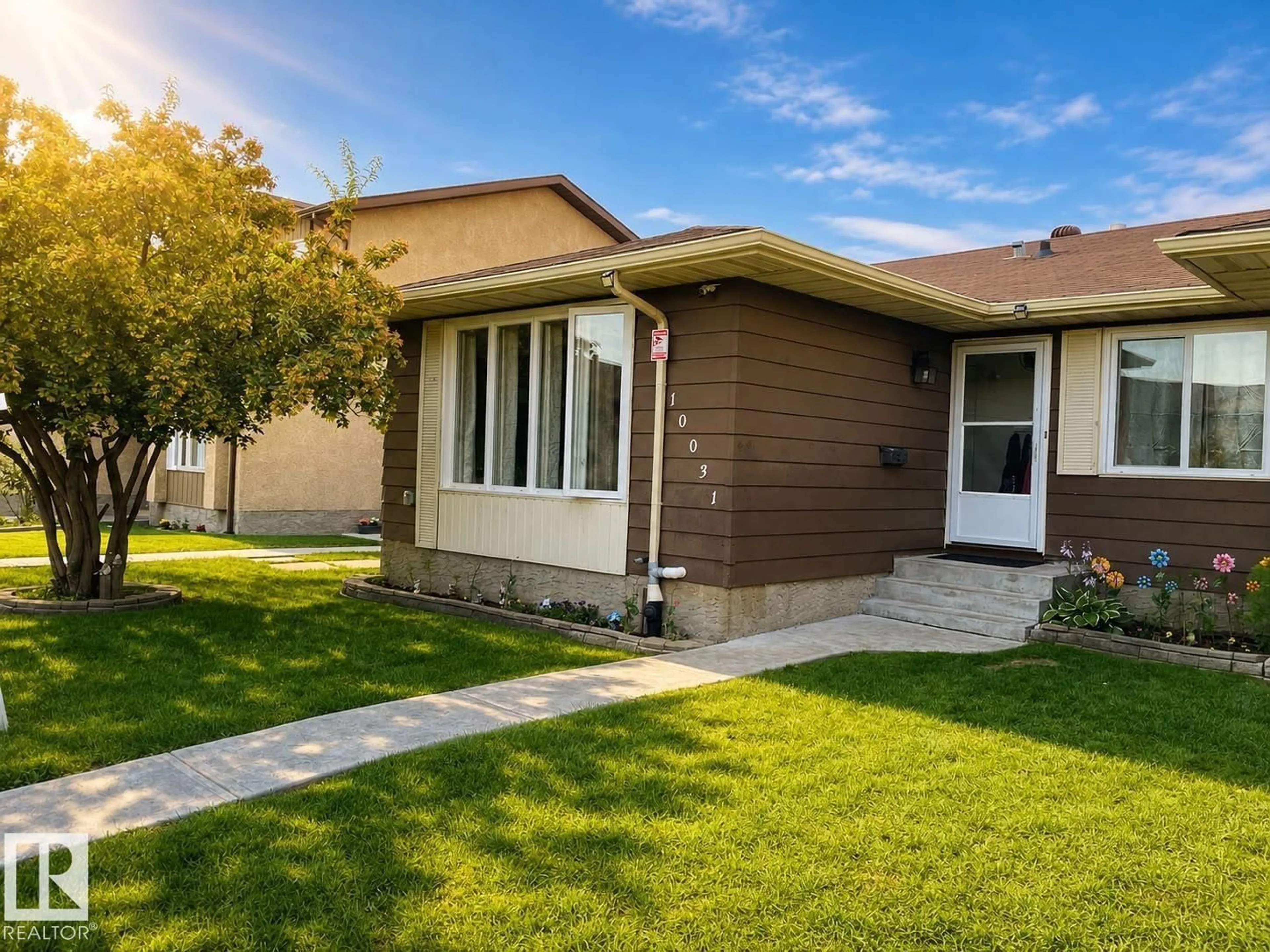 Home with vinyl exterior material, street for 10031 173 AV, Edmonton Alberta T5X3Y1