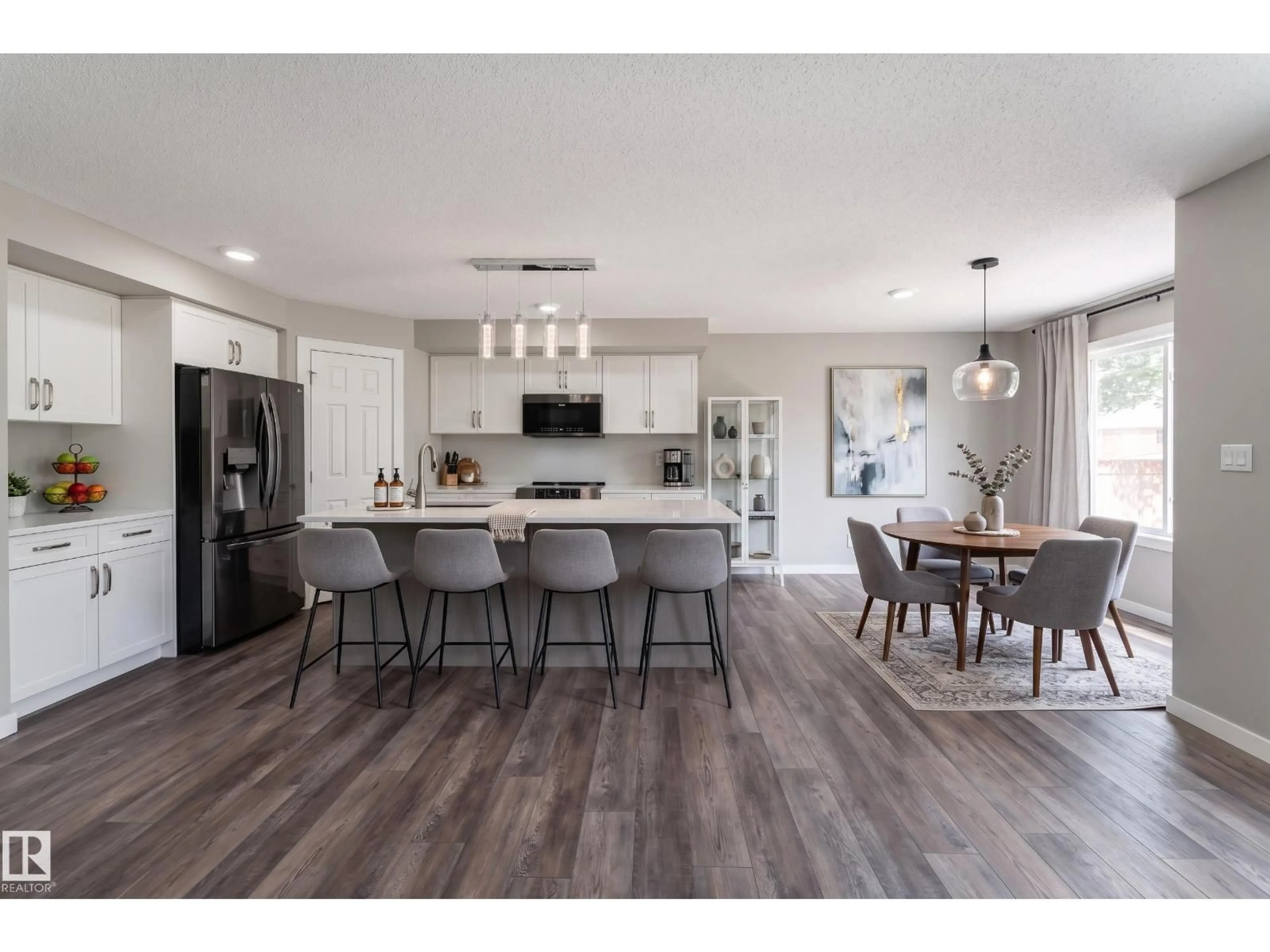 Open concept kitchen, wood/laminate floor for 101 RUE MONIQUE, Beaumont Alberta T4X0A1