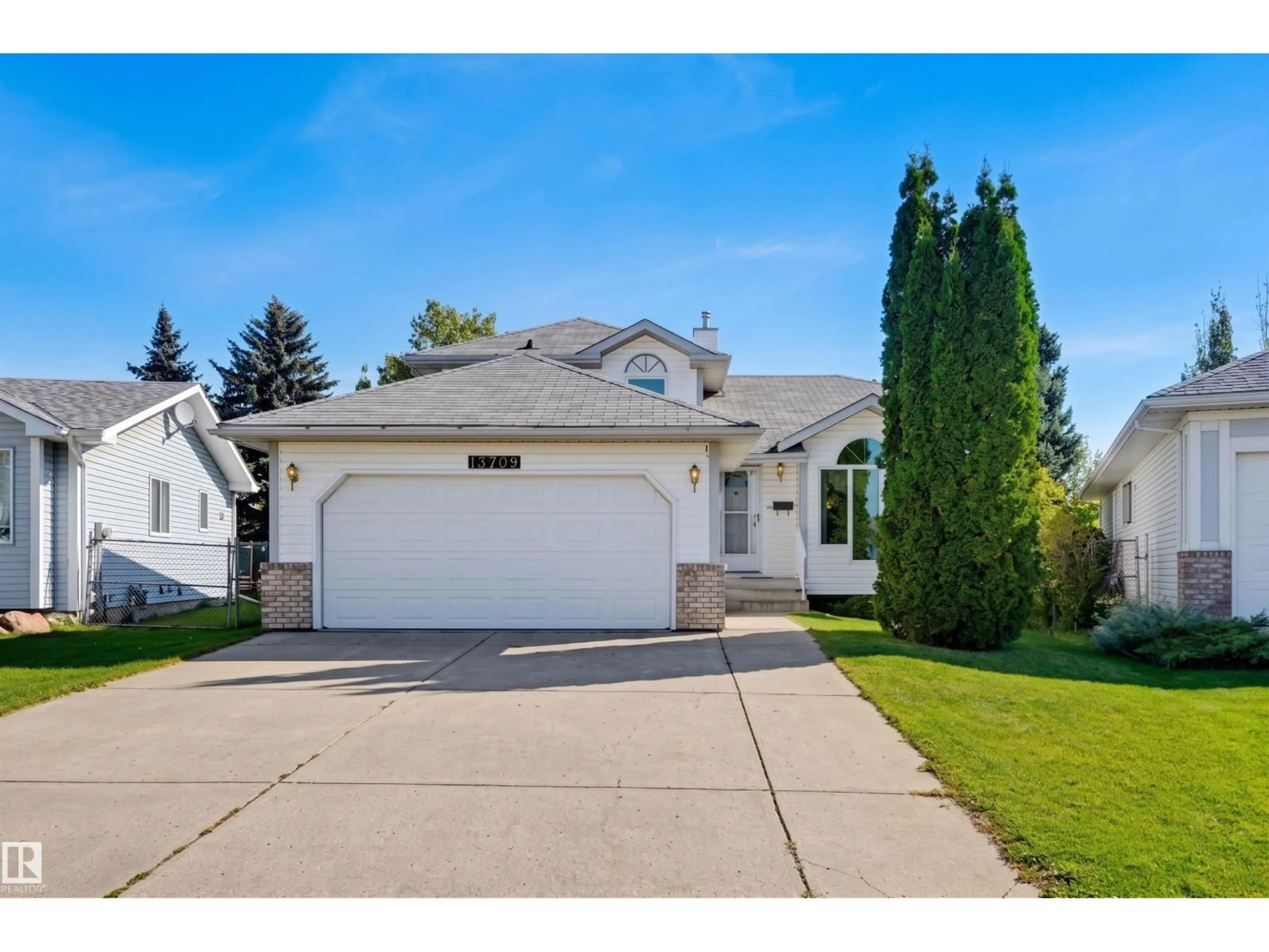 Home with vinyl exterior material, street for 13709 131 AV, Edmonton Alberta T5L5A3