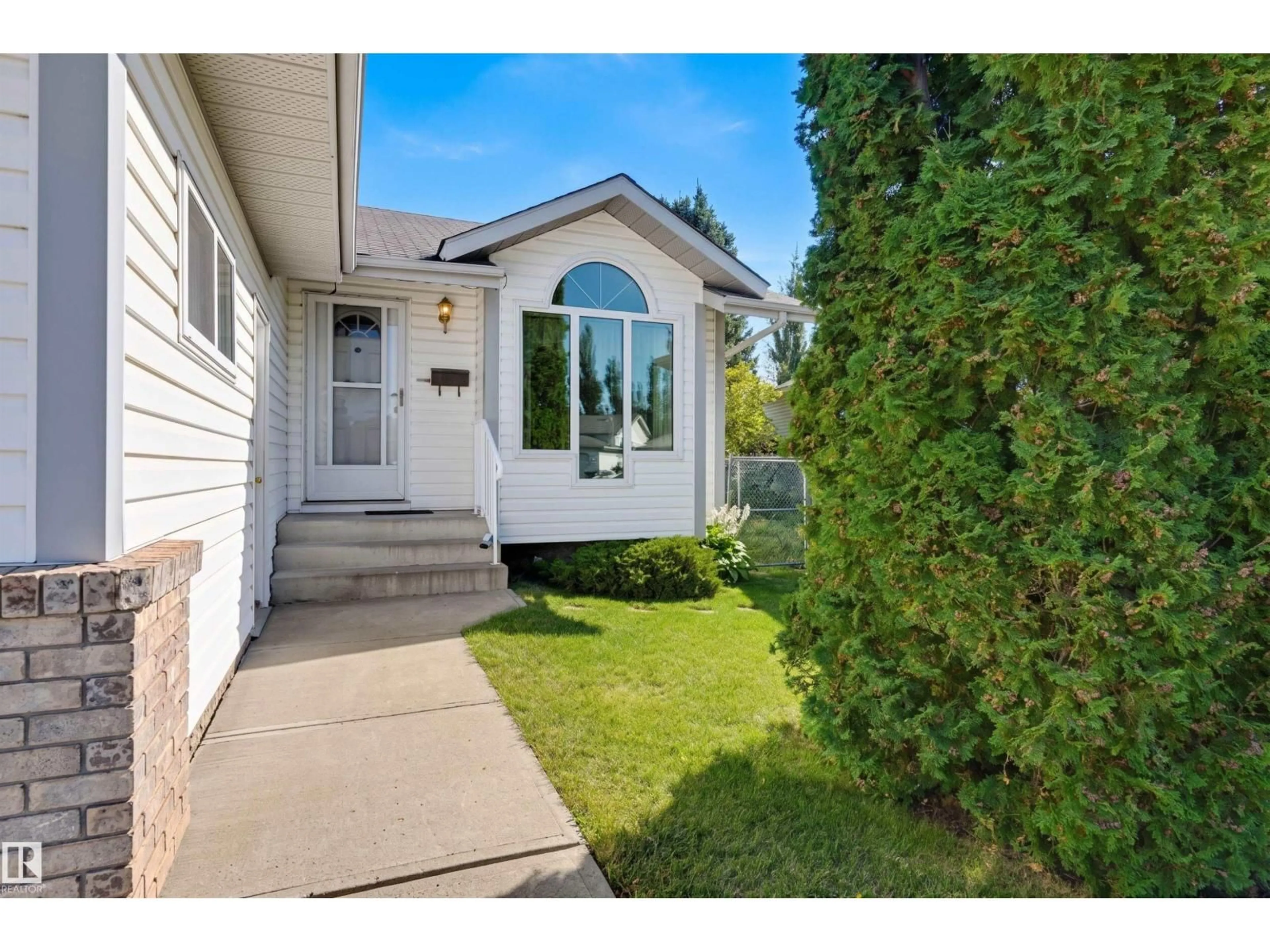Home with vinyl exterior material, street for 13709 131 AV, Edmonton Alberta T5L5A3