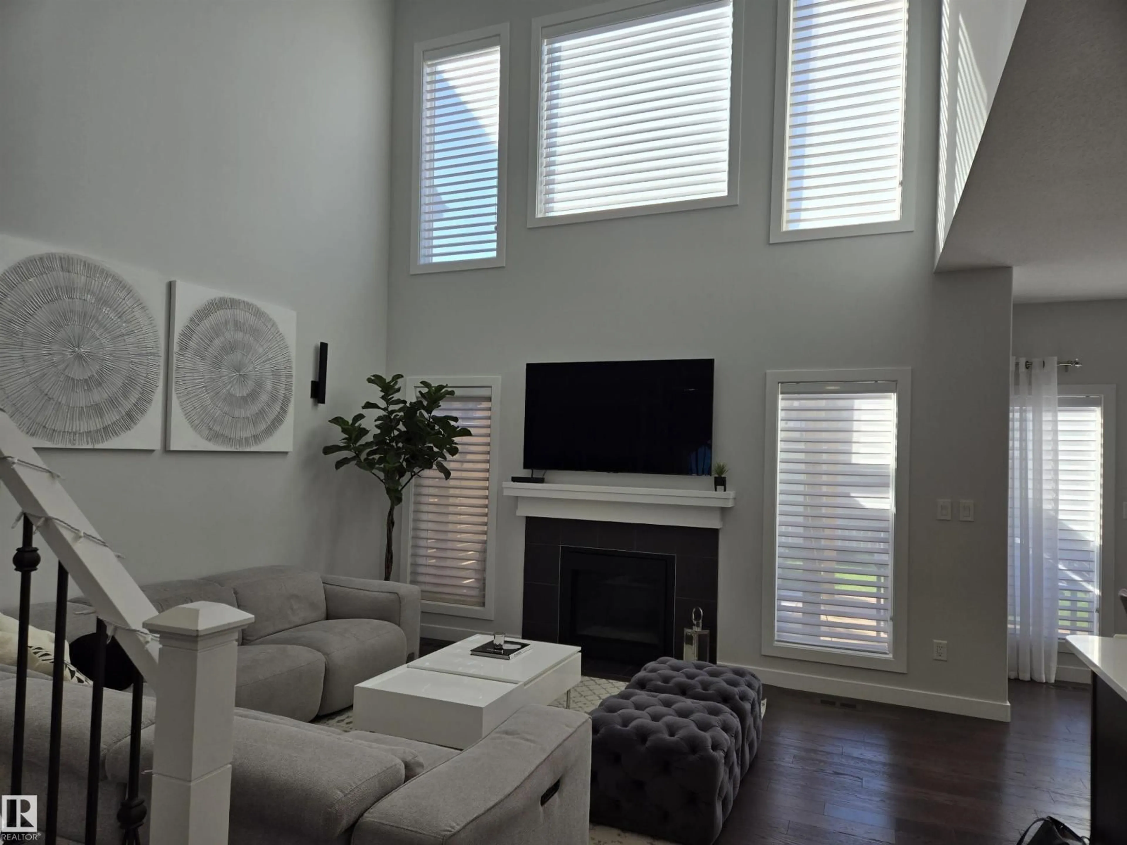 Living room with furniture, wood/laminate floor for SW - 15883 13 AV, Edmonton Alberta T6W2H5