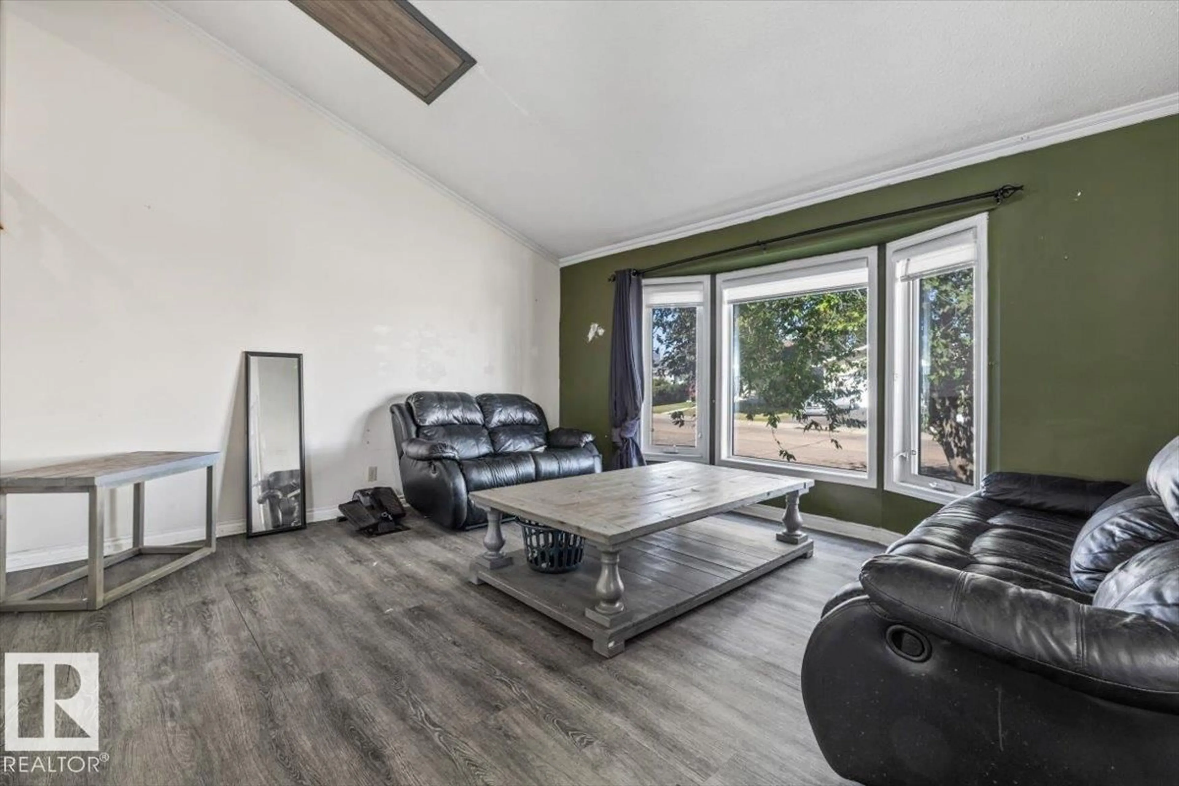 Living room with furniture, wood/laminate floor for 329 WARWICK RD, Edmonton Alberta T5X4R1