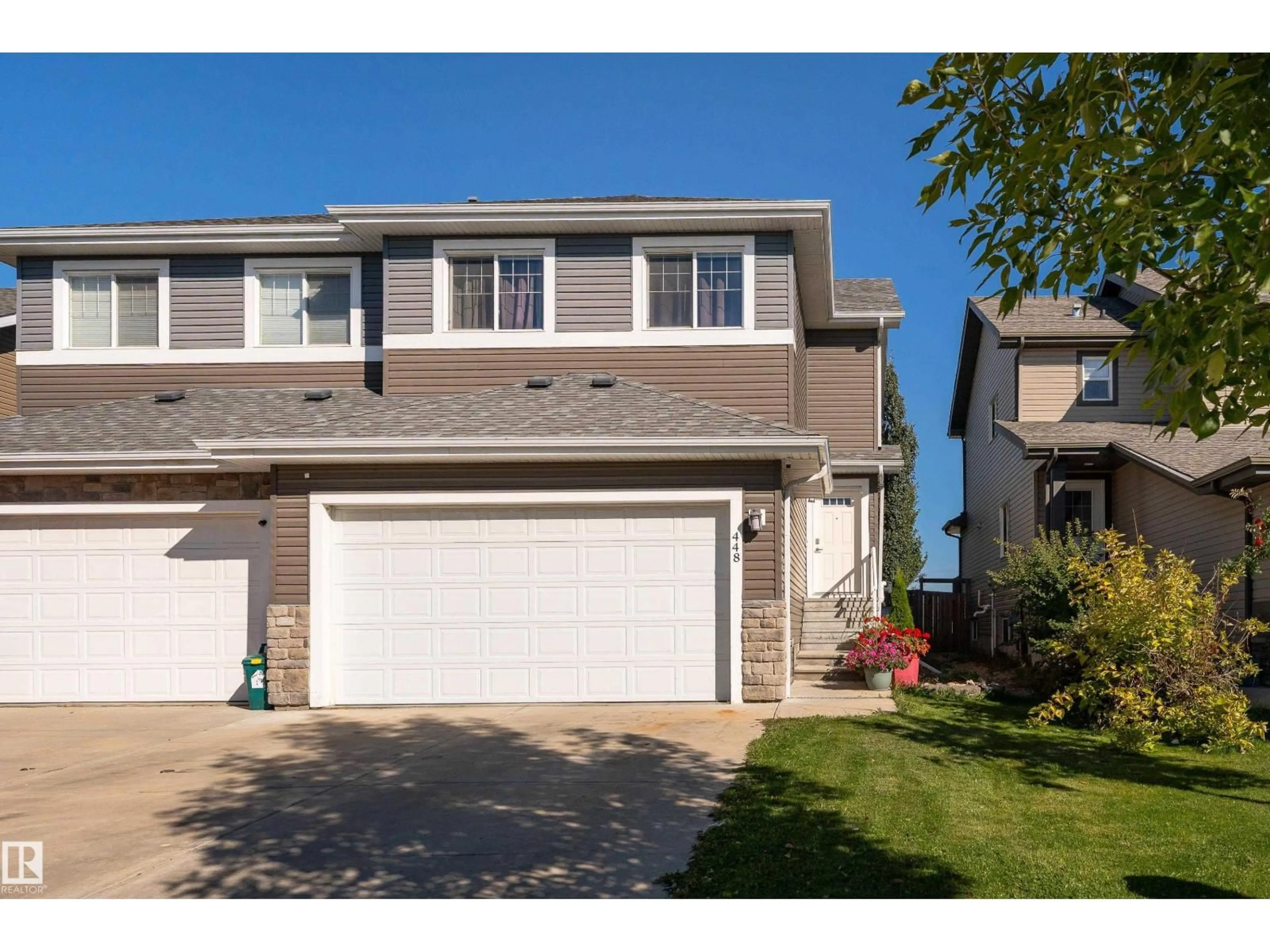 Home with vinyl exterior material, street for 448 REED CR, Leduc Alberta T9E0R5