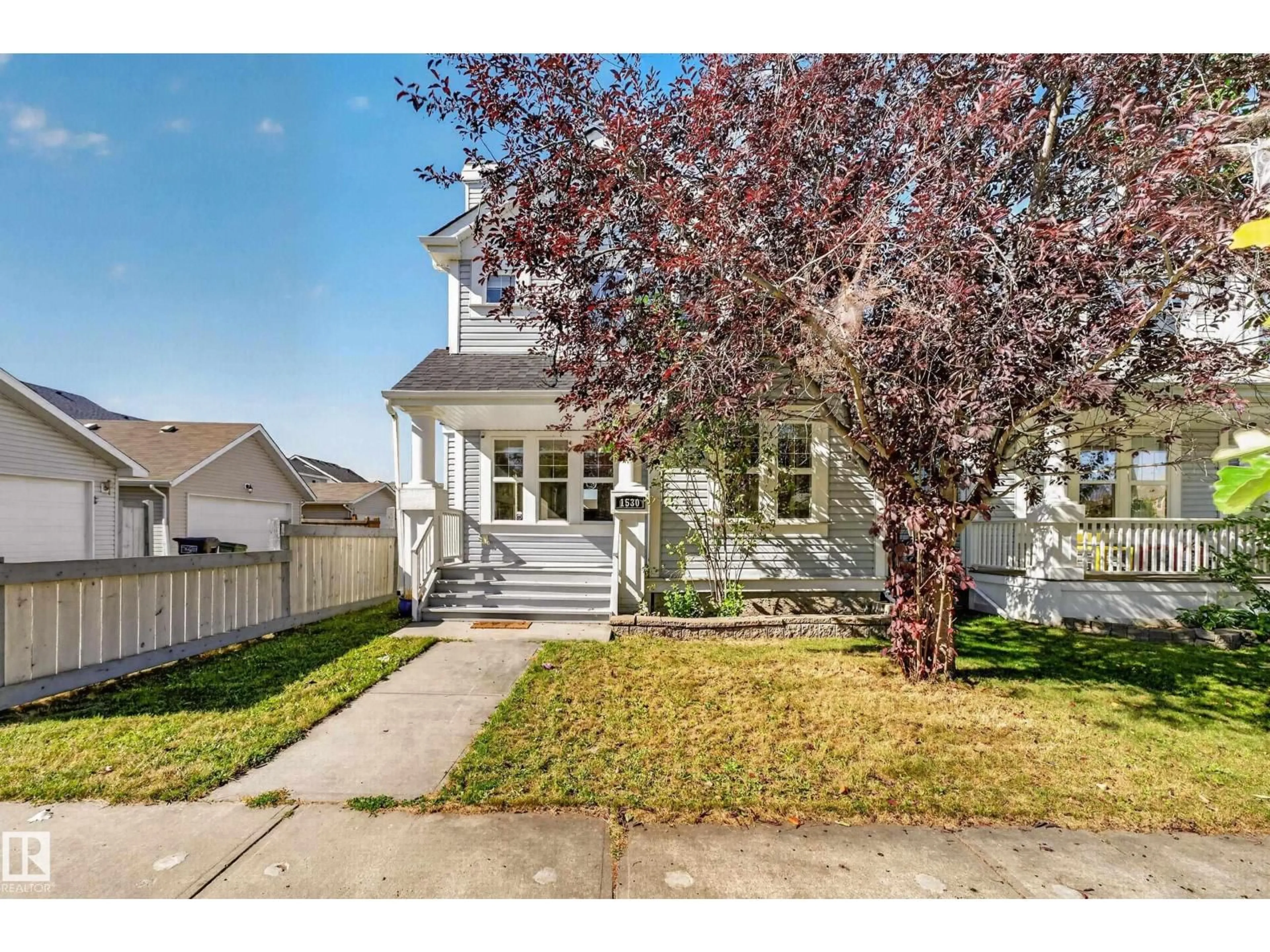 Home with vinyl exterior material, street for 1530 76 ST, Edmonton Alberta T6X1M3