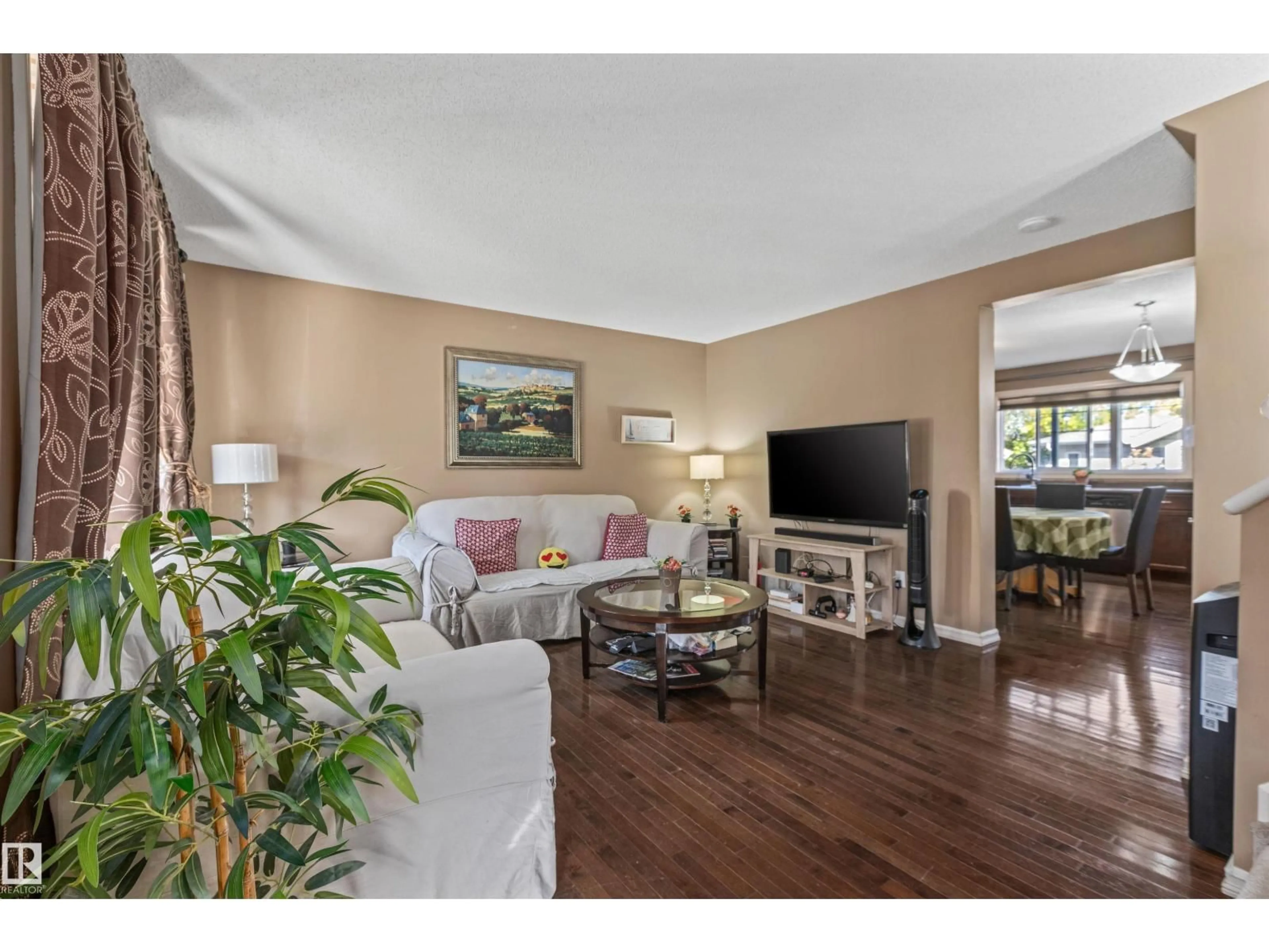 Living room with furniture, wood/laminate floor for 949 VALOUR WY, Edmonton Alberta T5E6P2