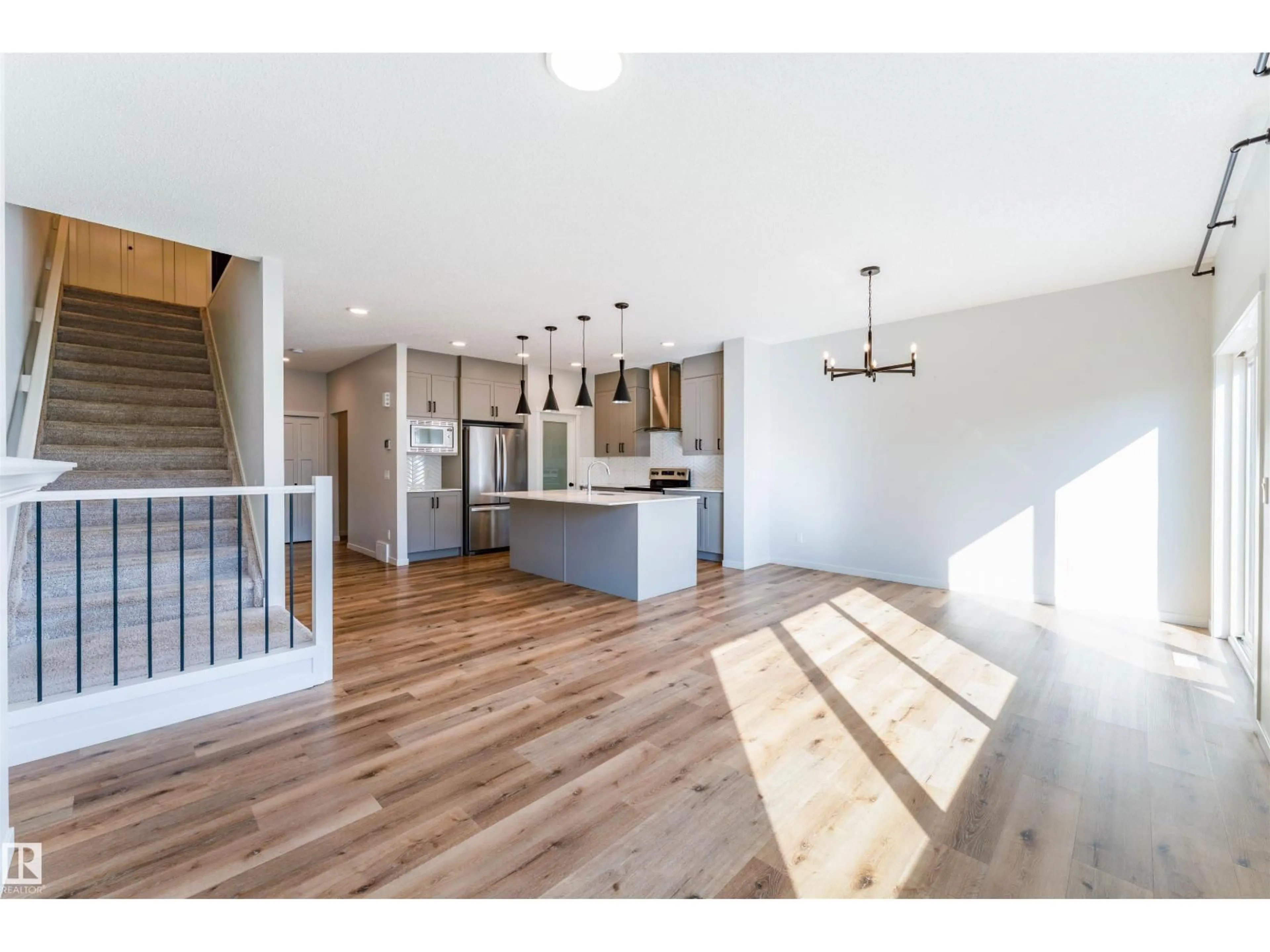 Open concept kitchen, wood/laminate floor for NW - 9235 223 ST, Edmonton Alberta T5T7M1