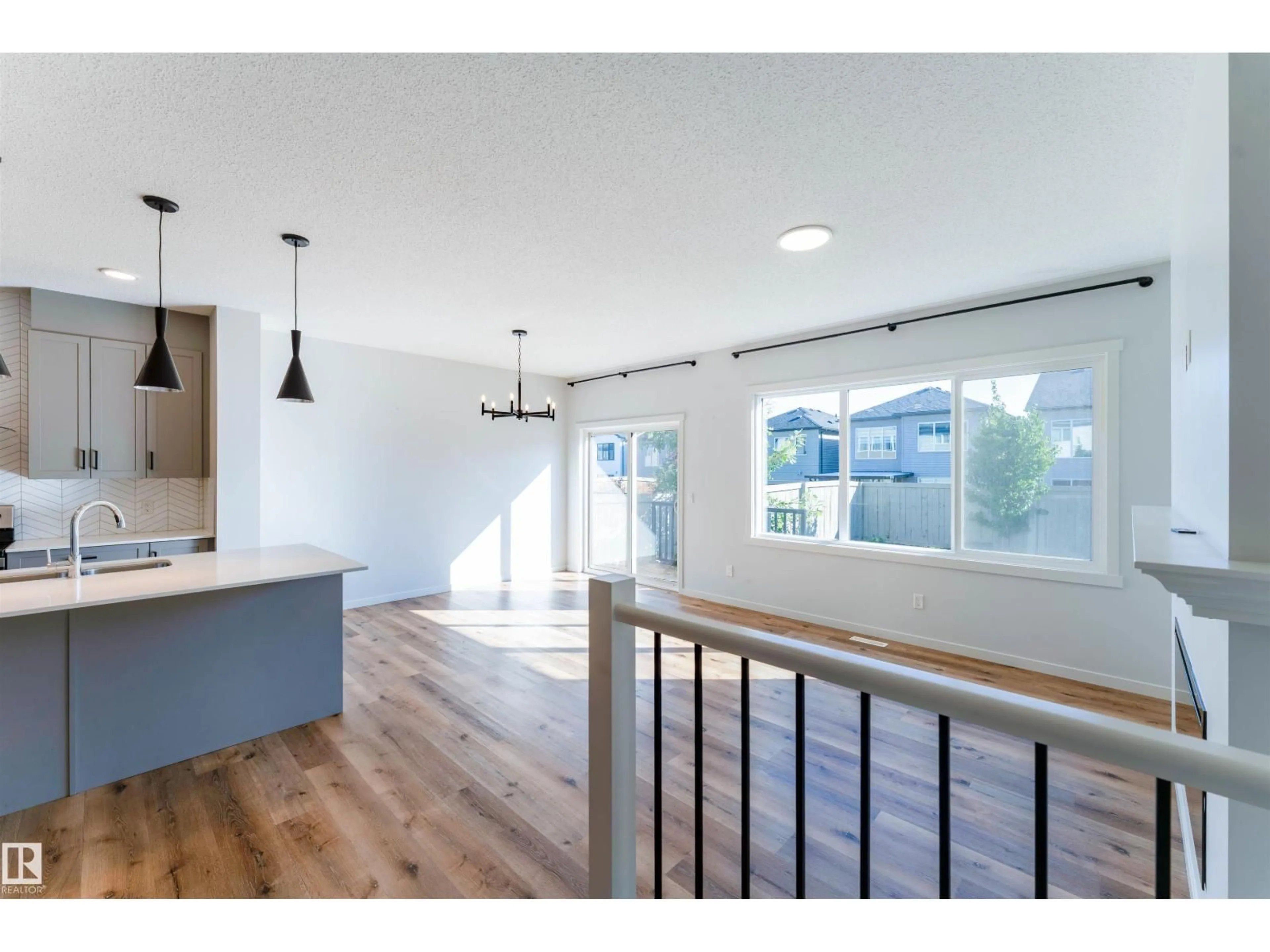 Open concept kitchen, wood/laminate floor for NW - 9235 223 ST, Edmonton Alberta T5T7M1