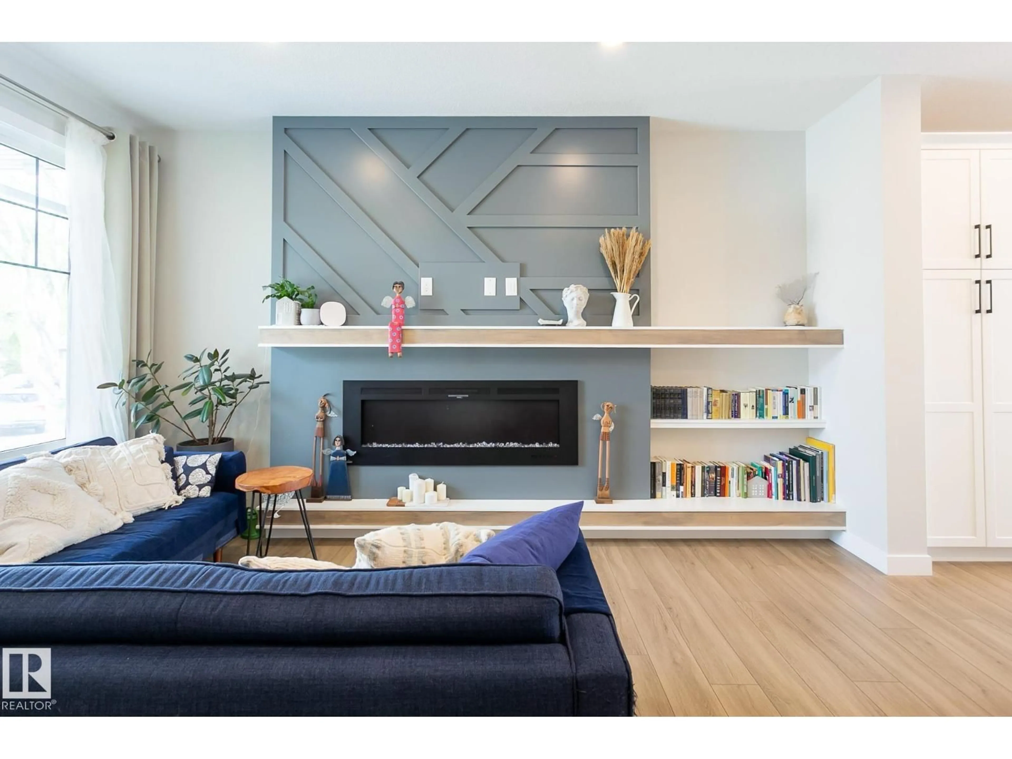 Living room with furniture, wood/laminate floor for 9111 65 AV, Edmonton Alberta T6E0J8