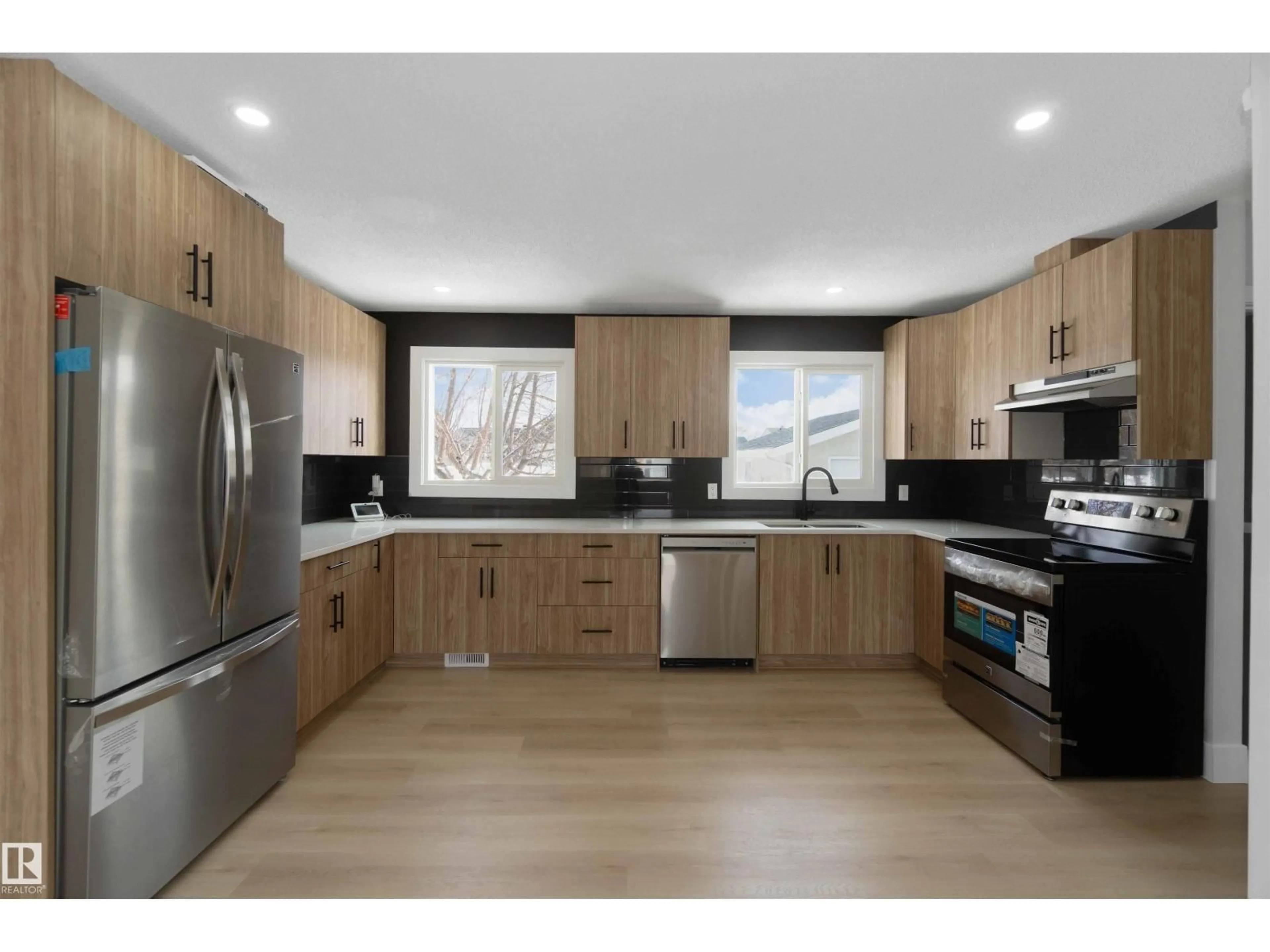 Open concept kitchen, wood/laminate floor for NW - 15015 95 ST, Edmonton Alberta T5E3Z3