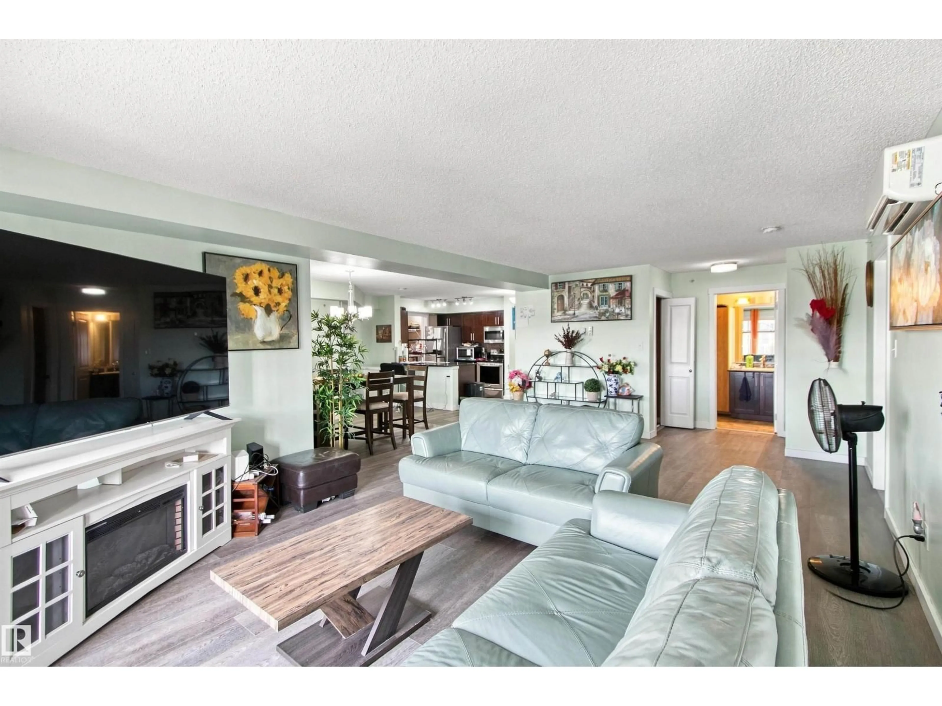 Living room with furniture, wood/laminate floor for #413 - 18126 77 ST, Edmonton Alberta T5Z0N7