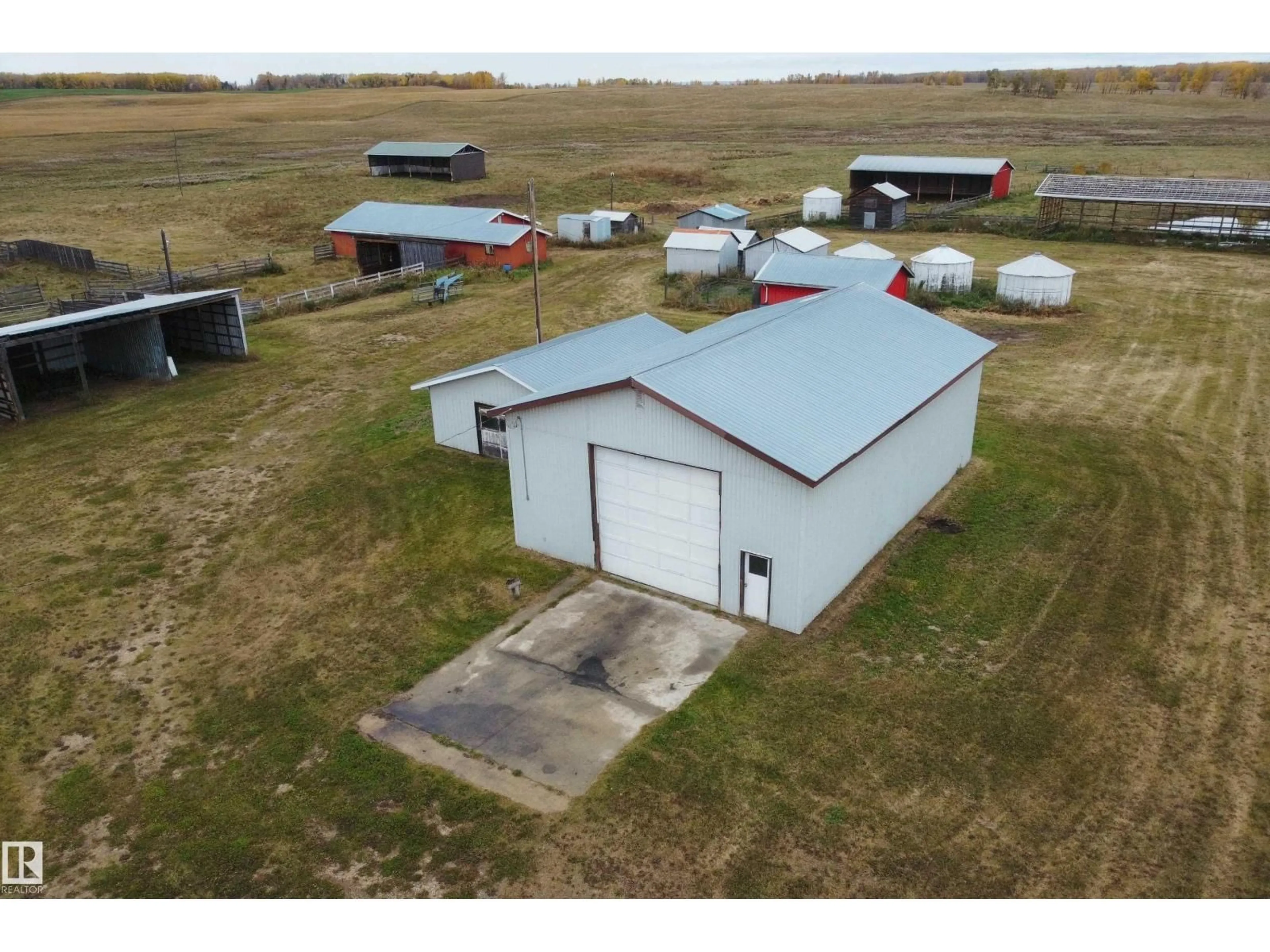 A pic from outside/outdoor area/front of a property/back of a property/a pic from drone, building for 61302 RGE RD 50, Rural Barrhead County Alberta T7N1N2