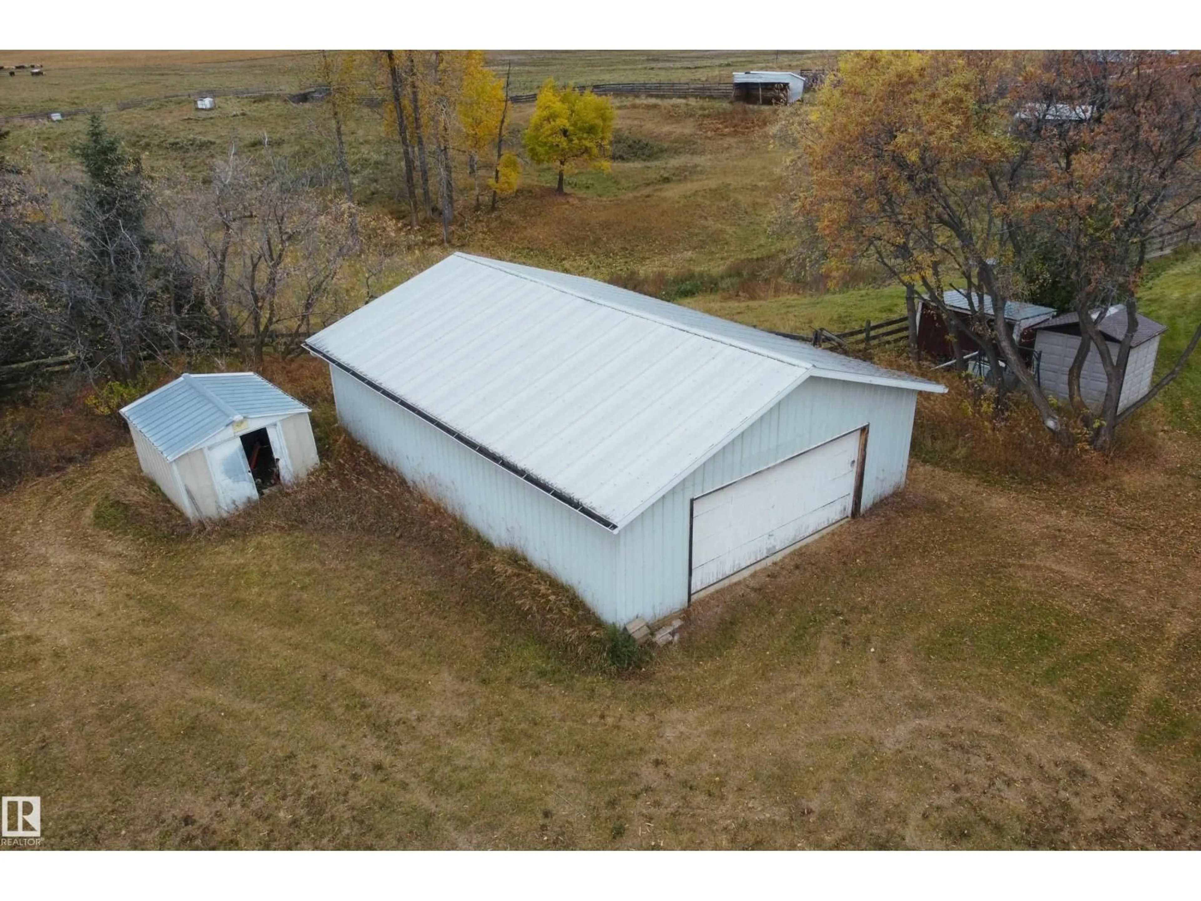 A pic from outside/outdoor area/front of a property/back of a property/a pic from drone, building for 61302 RGE RD 50, Rural Barrhead County Alberta T7N1N2