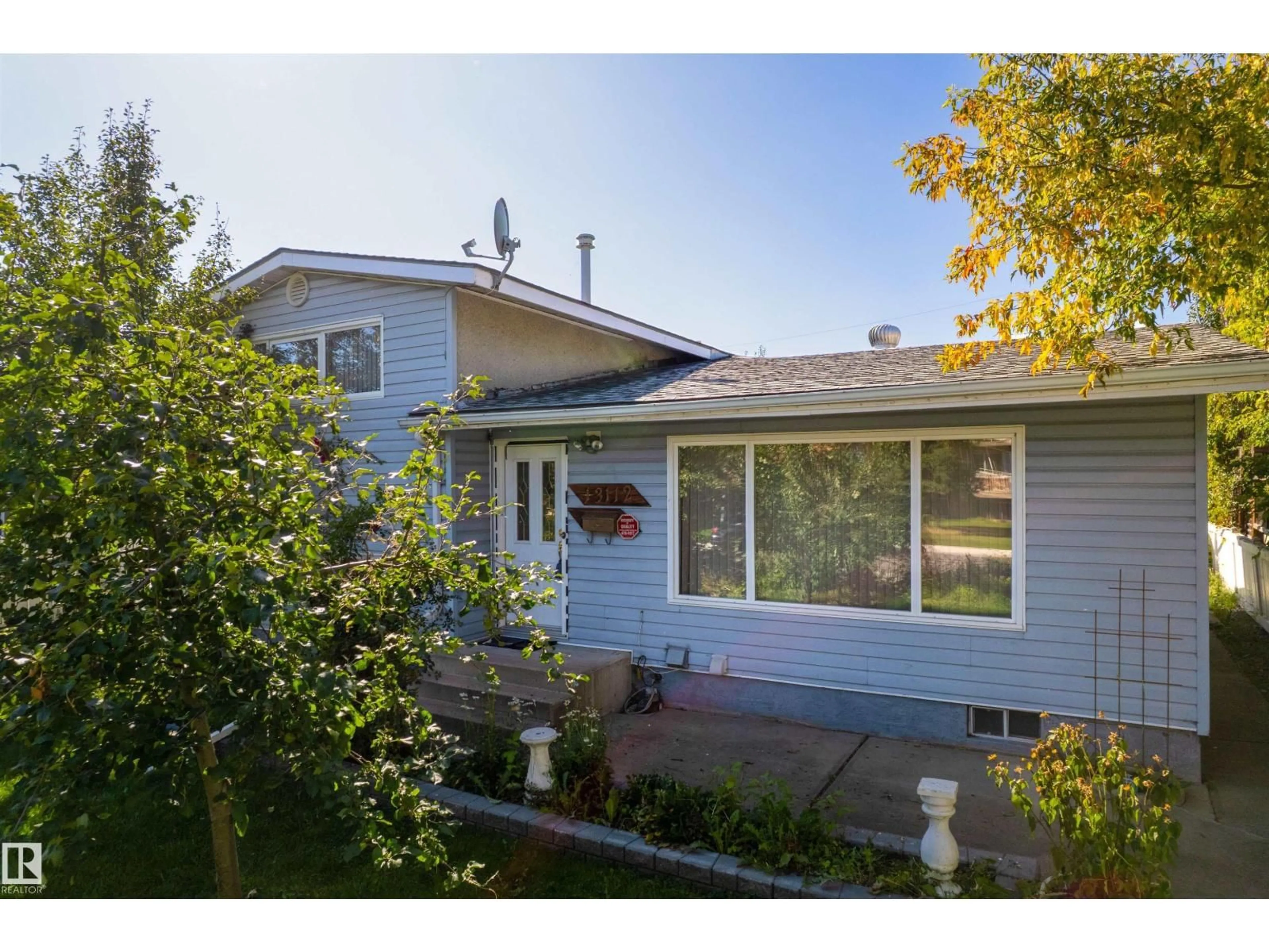 Home with vinyl exterior material, street for NW - 13112 83 ST, Edmonton Alberta T5E2W6