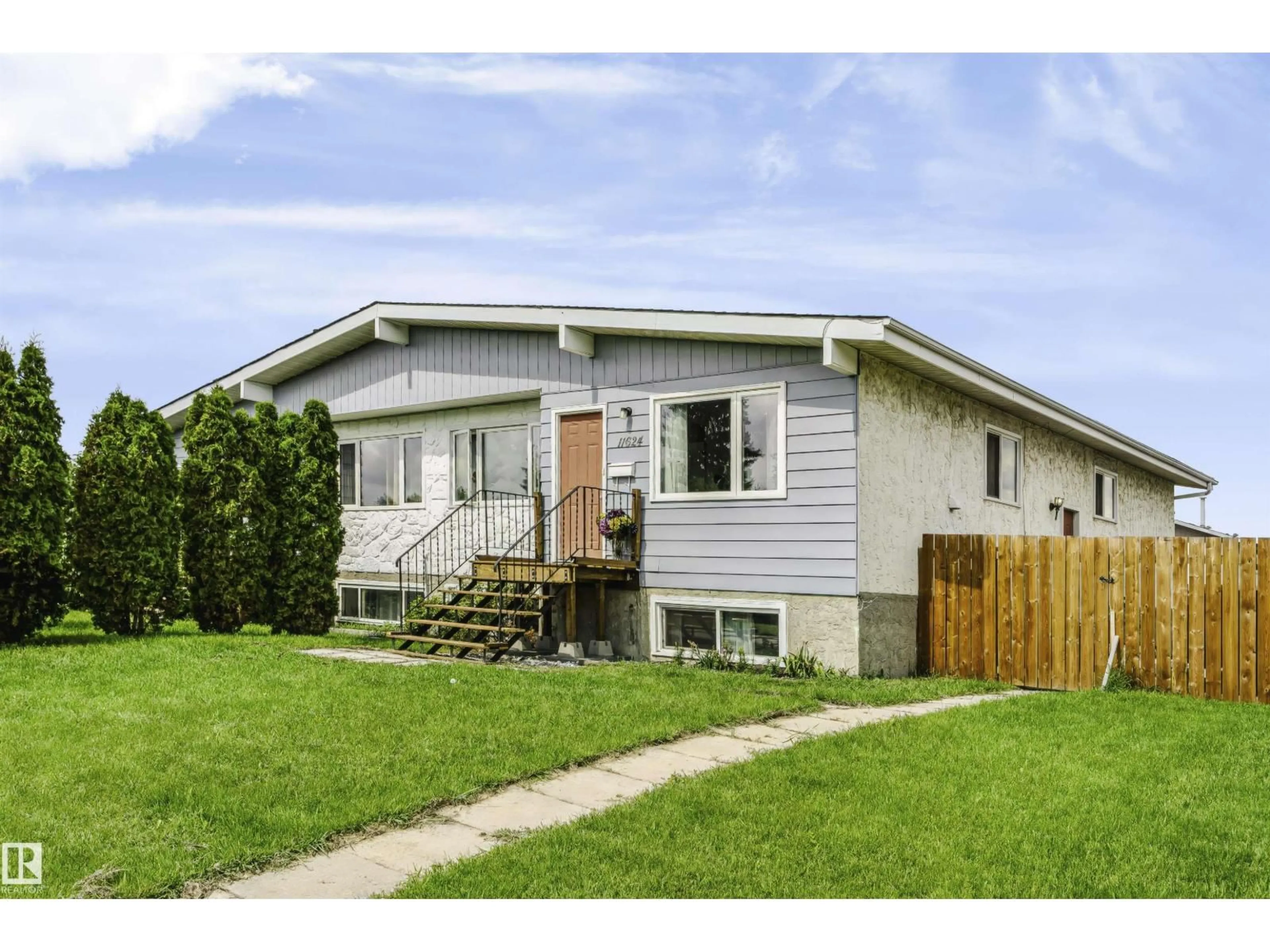 Home with vinyl exterior material, street for 11624 152 AV, Edmonton Alberta T5X1C7