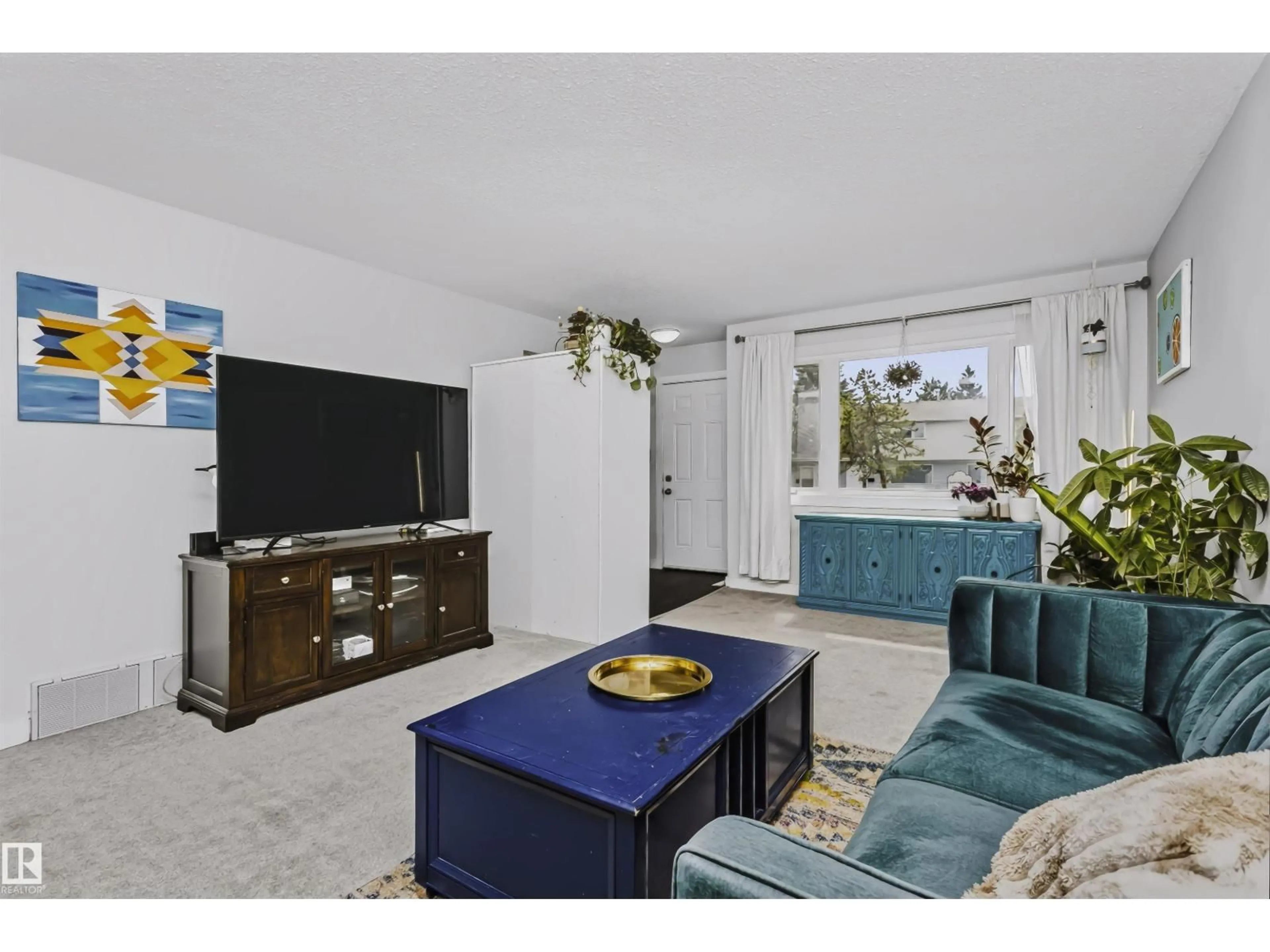 Living room with furniture, unknown for 11624 152 AV, Edmonton Alberta T5X1C7
