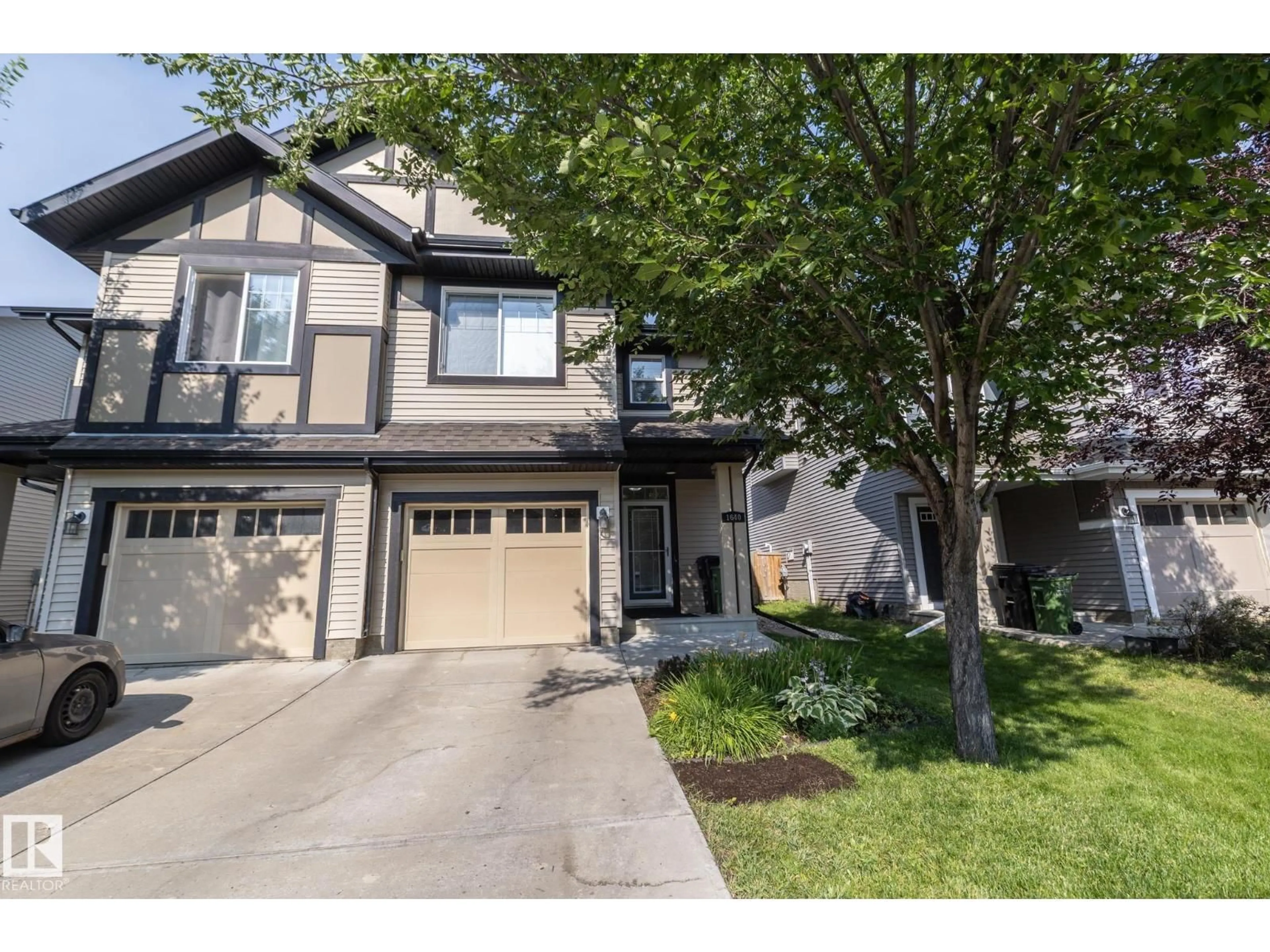 Home with vinyl exterior material, street for 1640 CHAPMAN WY, Edmonton Alberta T6W0Y5