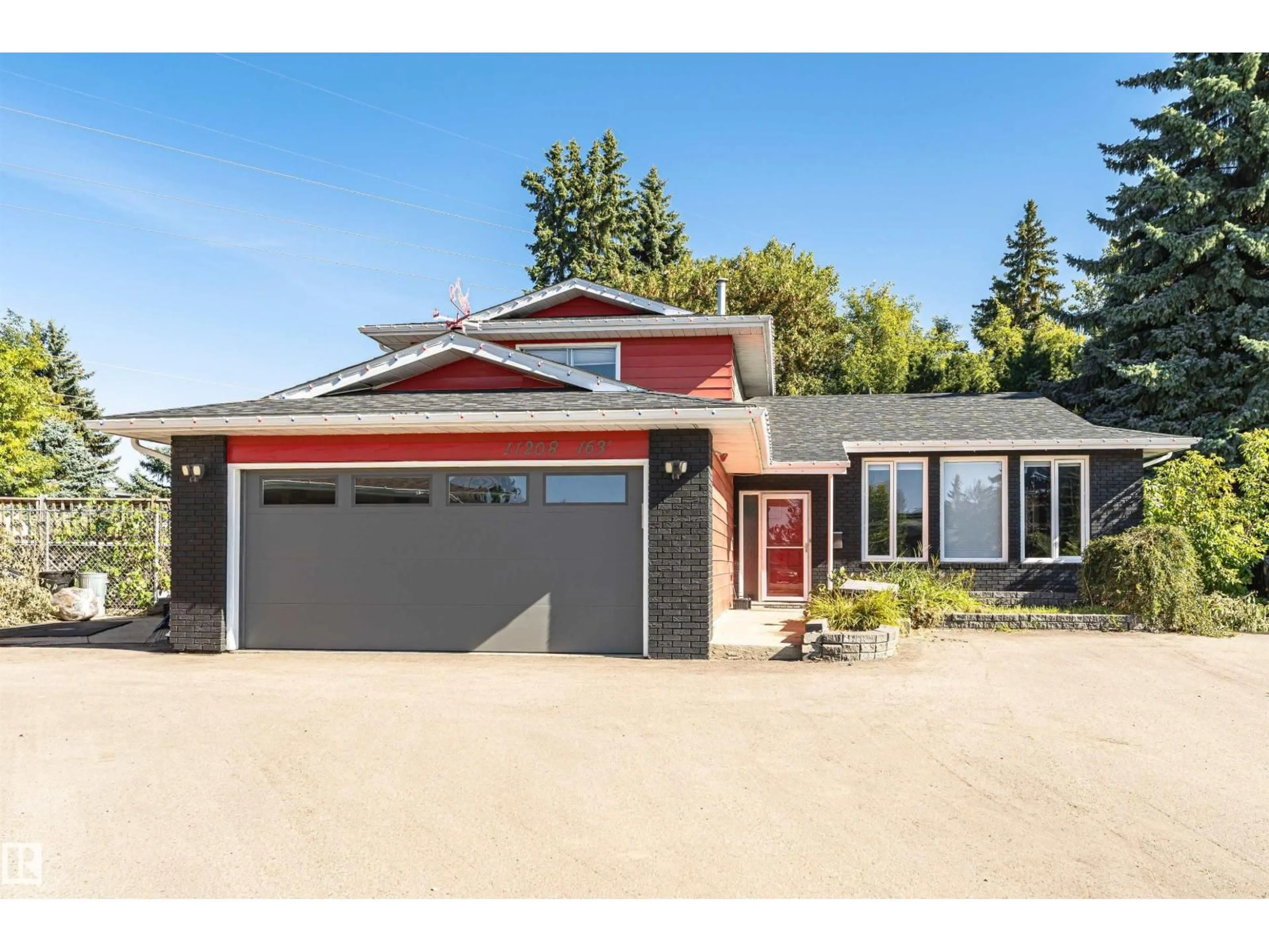 Home with vinyl exterior material, street for 11208 163A AV, Edmonton Alberta T5X2A6