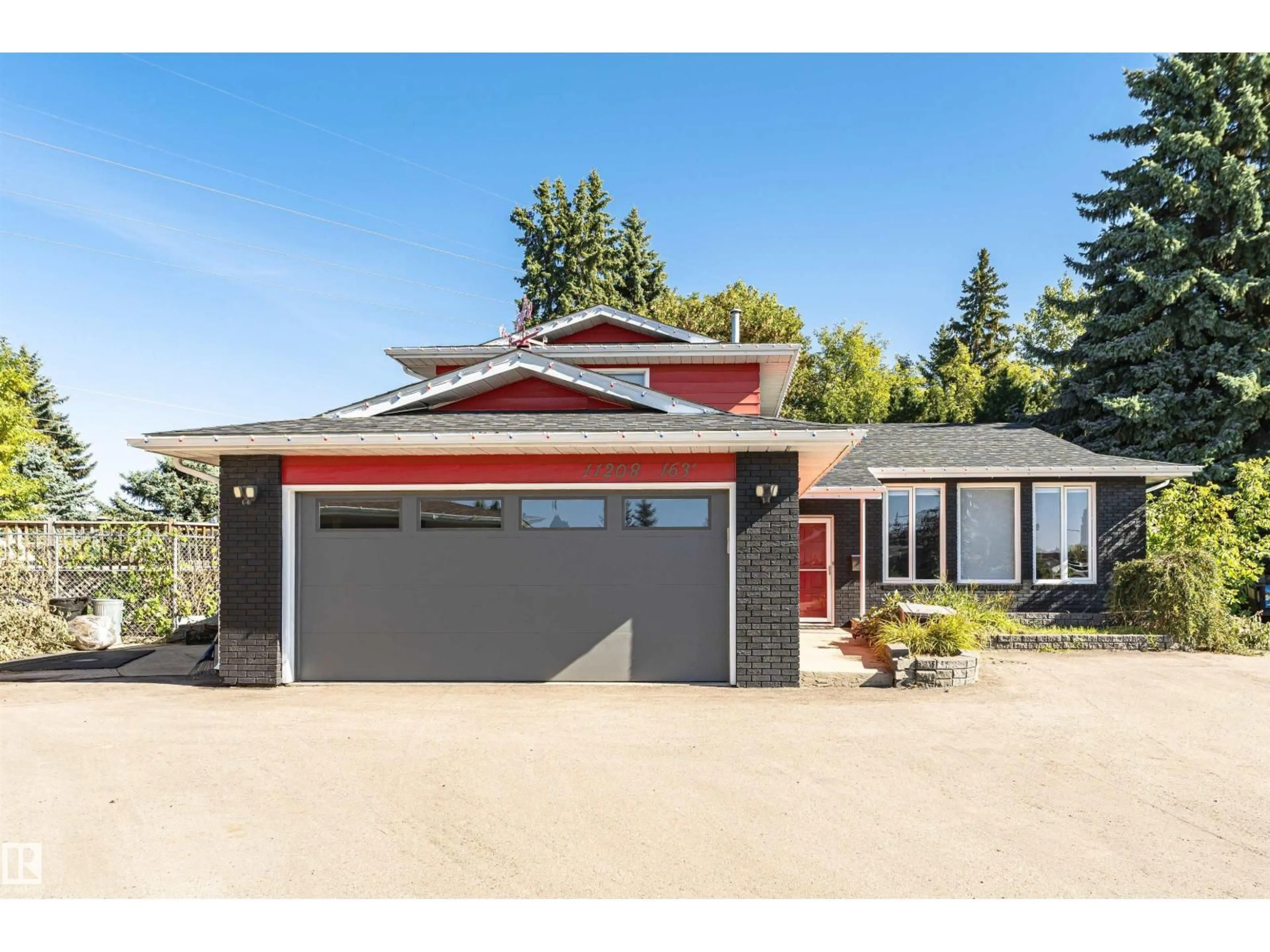 Home with vinyl exterior material, street for 11208 163A AV, Edmonton Alberta T5X2A6