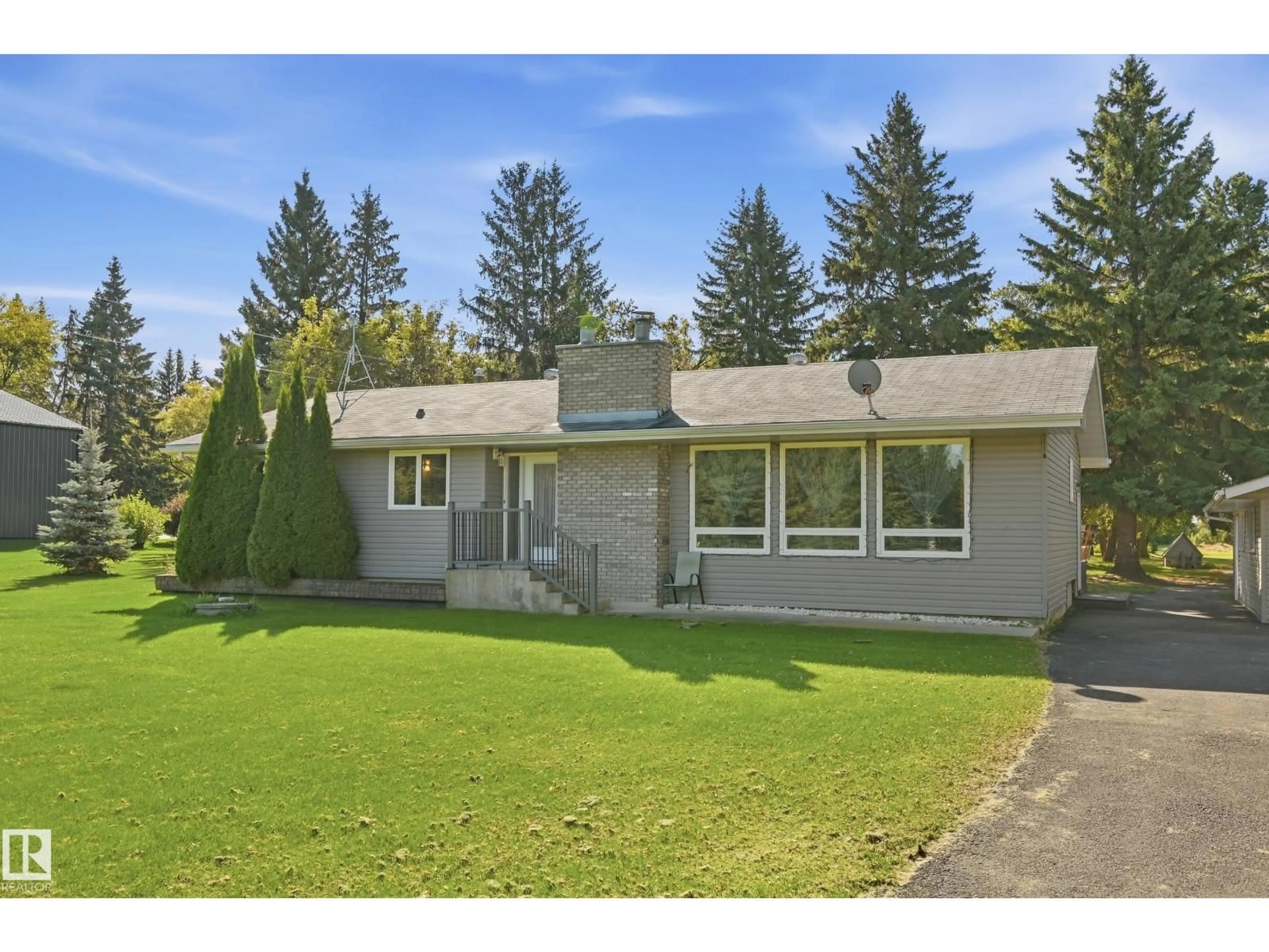 Home with vinyl exterior material, street for 52426 - 16 RANGE ROAD 265, Rural Parkland County Alberta T7X3H2