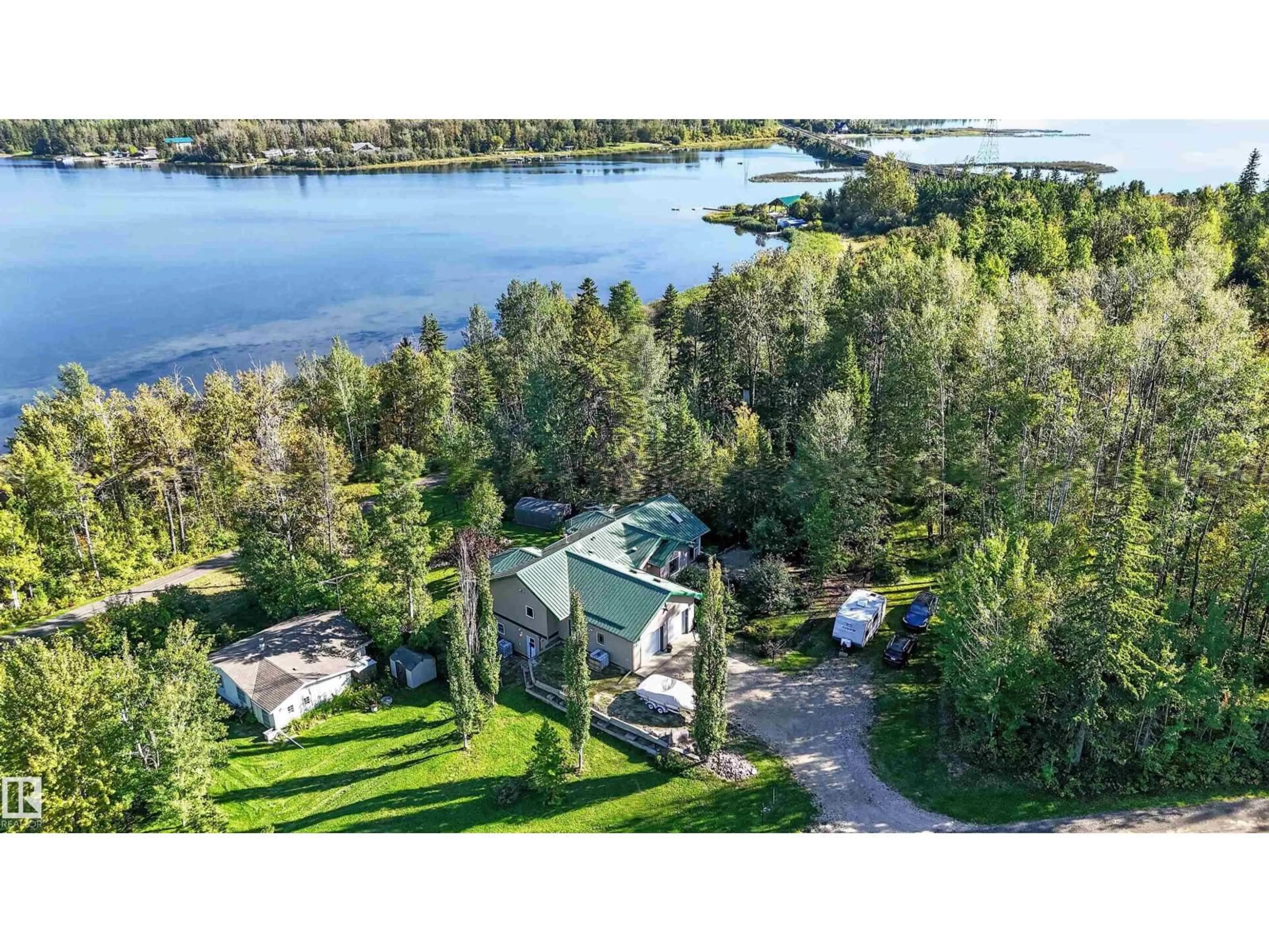 A pic from outside/outdoor area/front of a property/back of a property/a pic from drone, water/lake/river/ocean view for 225 BAYVIEW DR, Rural Parkland County Alberta T0E2K0