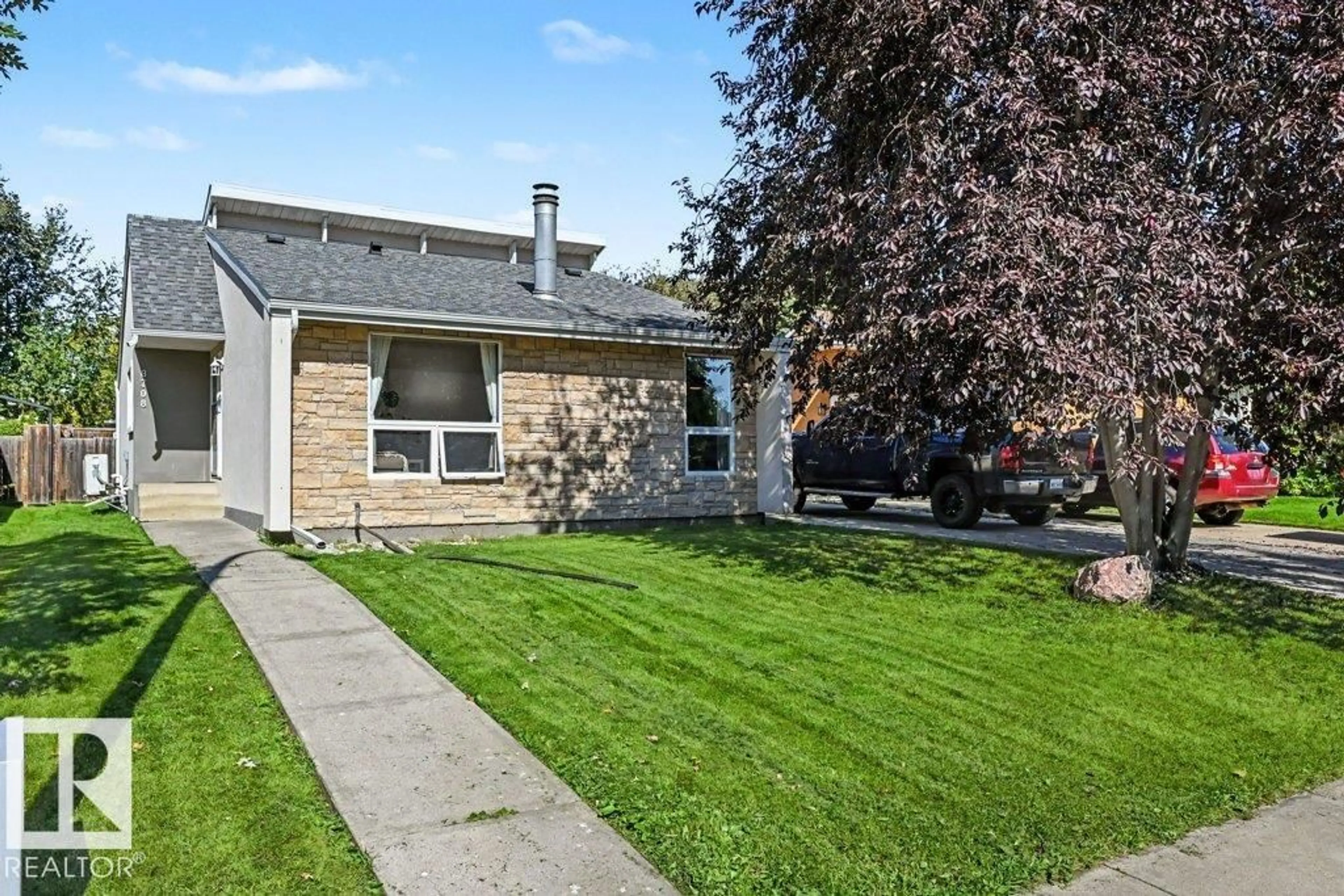 Home with vinyl exterior material, street for NW - 8708 25A AV, Edmonton Alberta T6K2W7