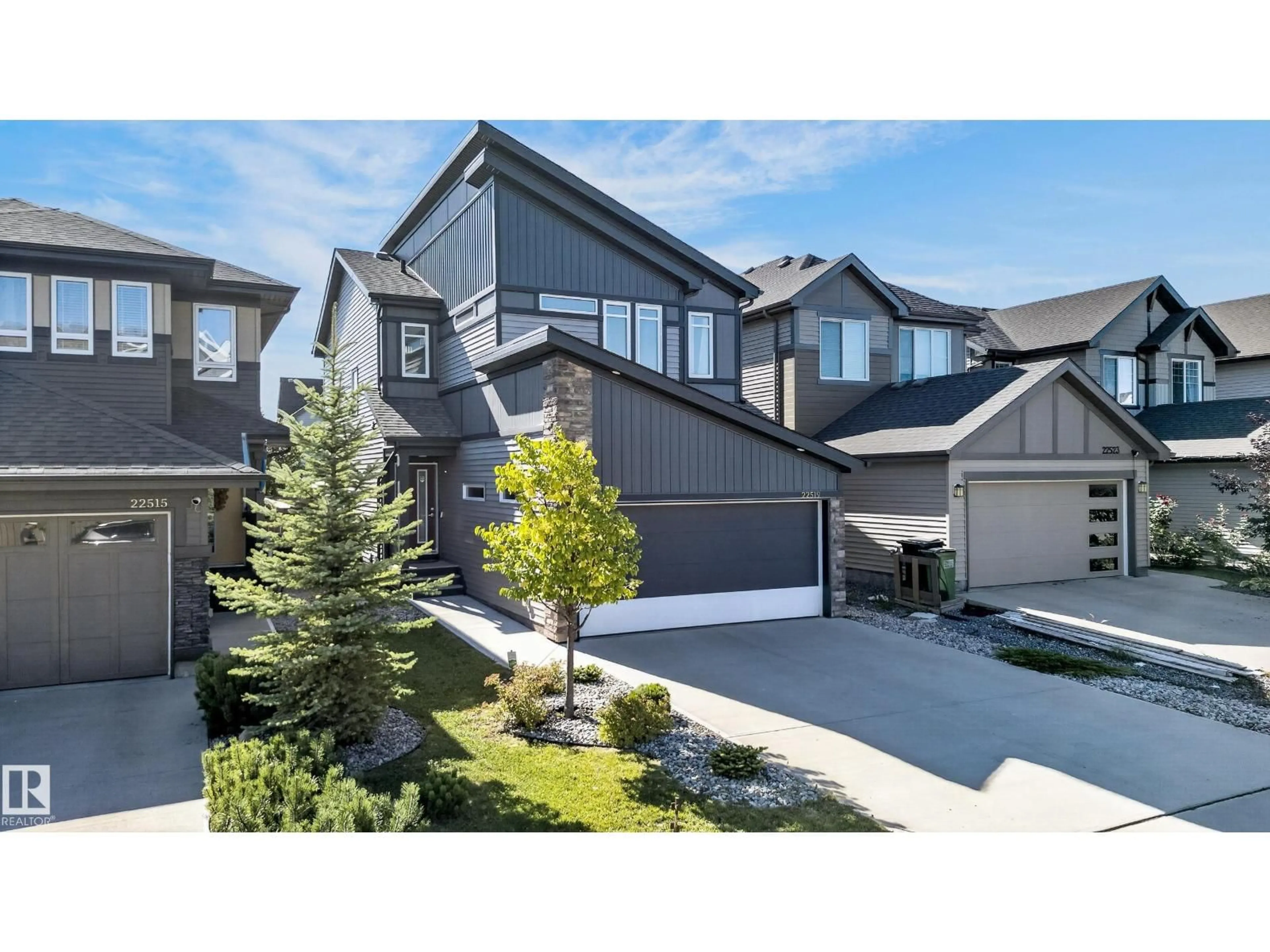 Home with vinyl exterior material, street for 22519 96 AV, Edmonton Alberta T5T7K5