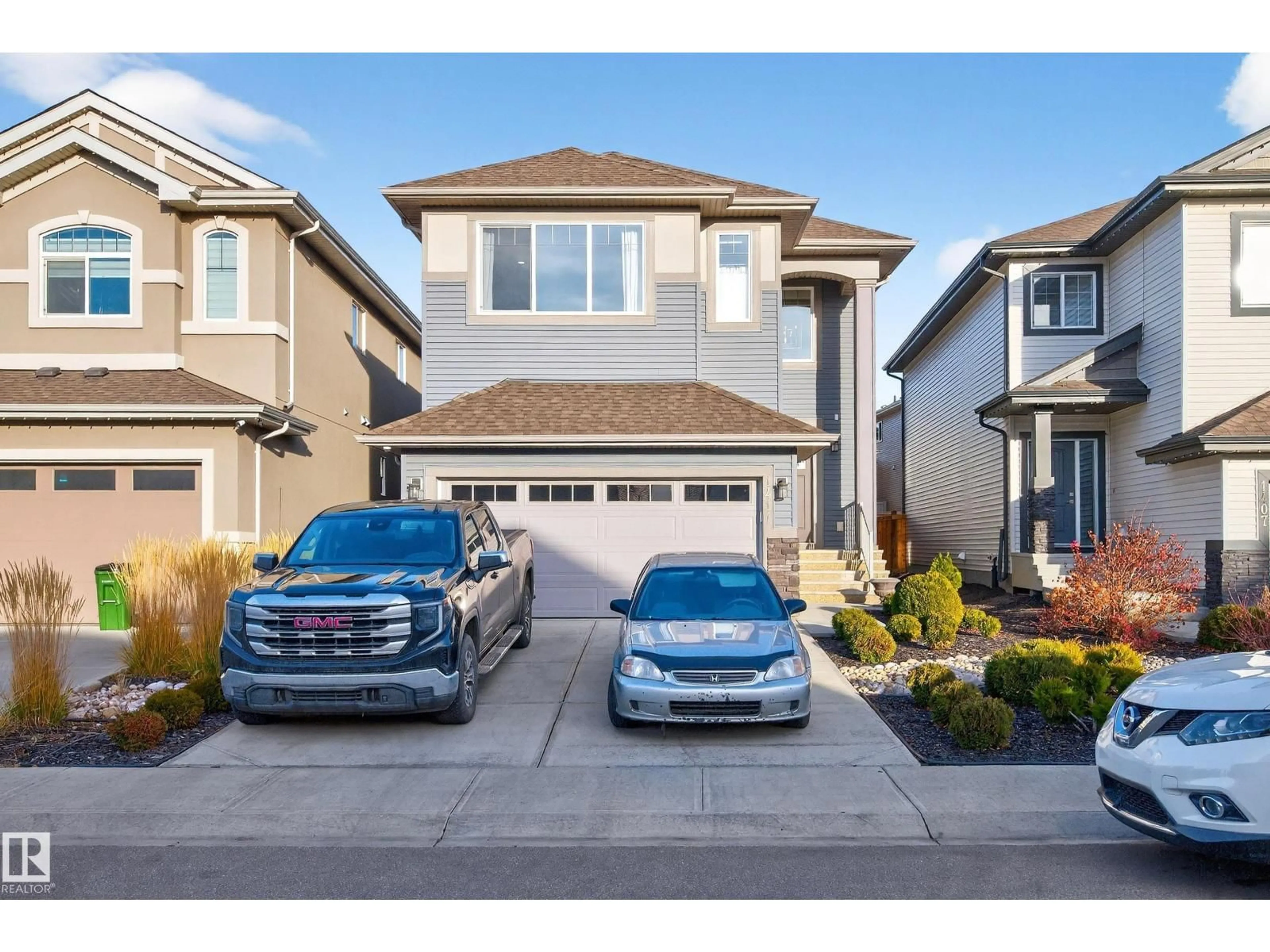 Home with vinyl exterior material, street for NW - 1411 25 ST, Edmonton Alberta T6T2K7
