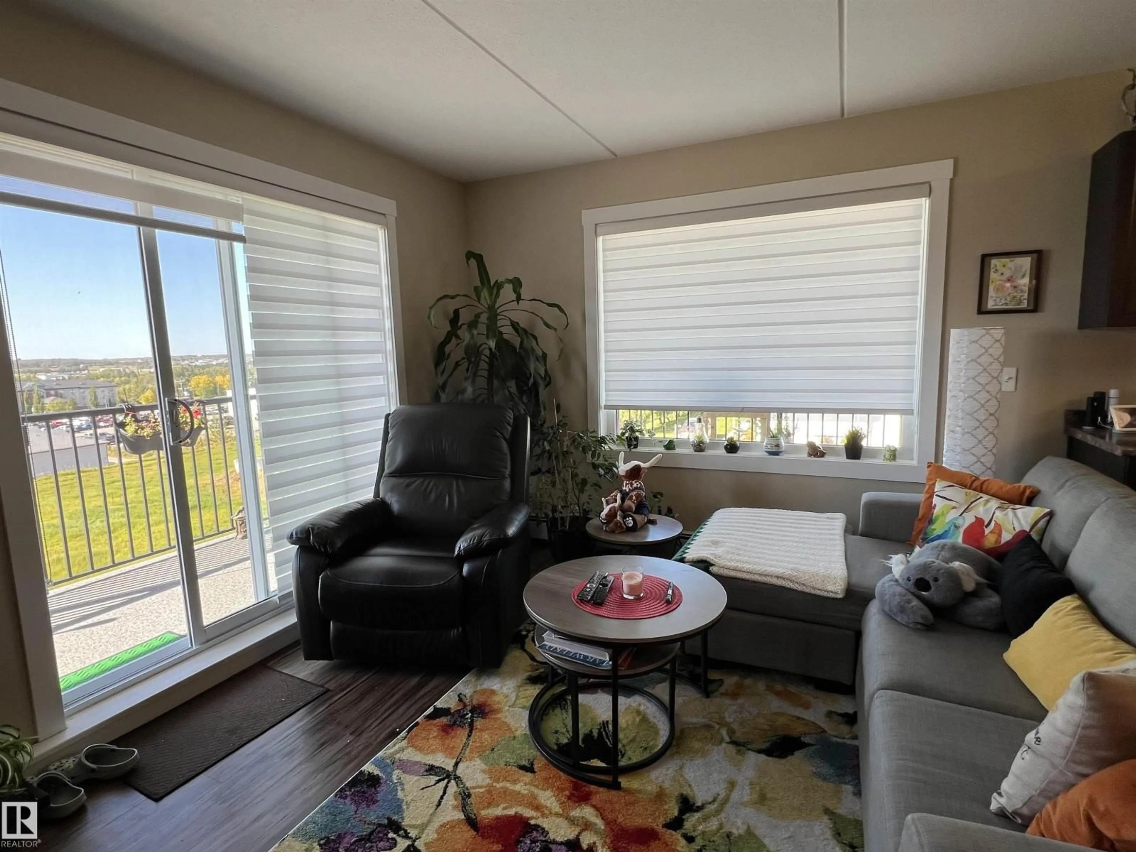 Living room with furniture, wood/laminate floor for 307 - 4002 47 ST, Drayton Valley Alberta T7A0A2
