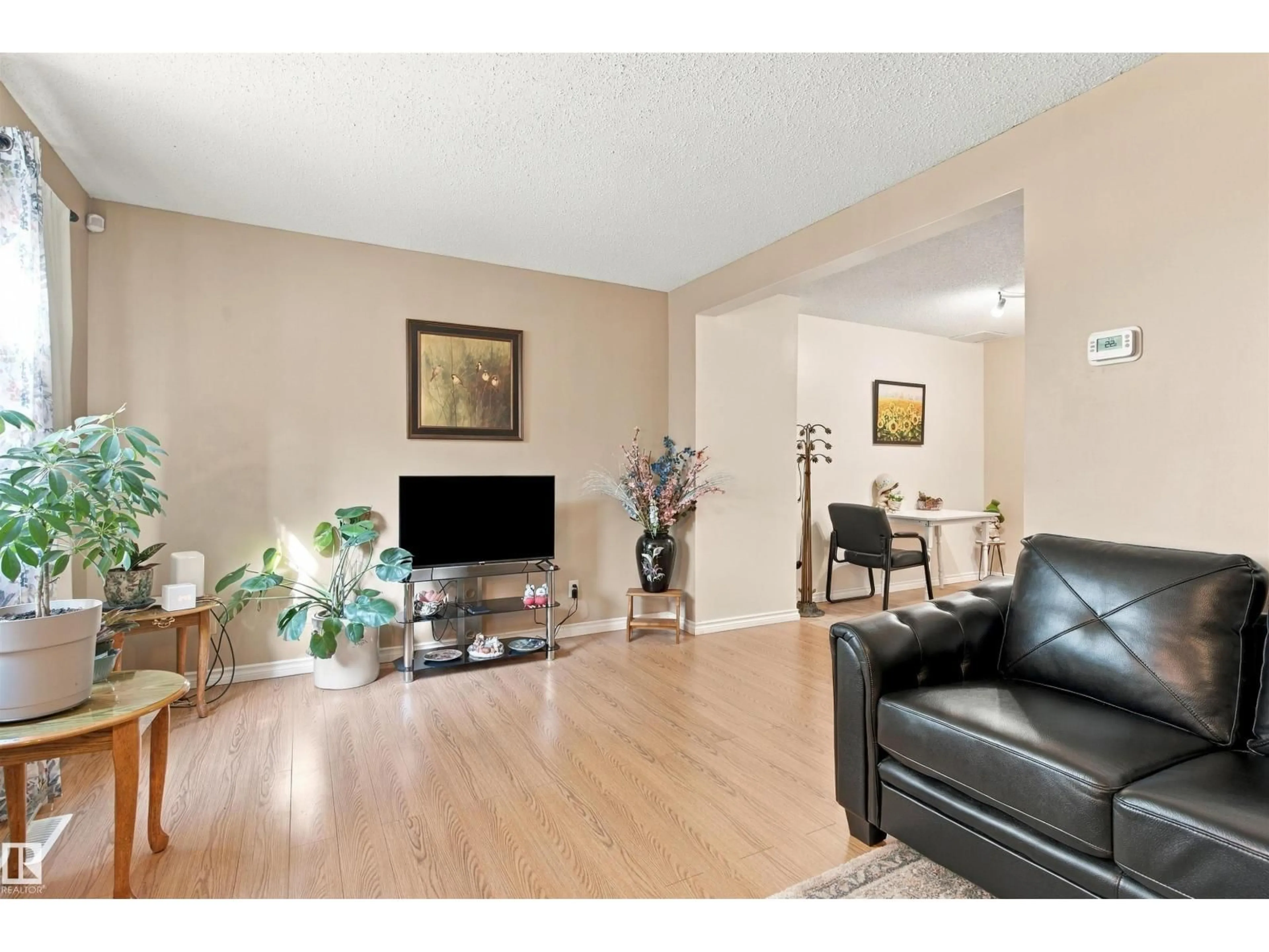 Living room with furniture, wood/laminate floor for 52 BELMEAD GARDENS GD, Edmonton Alberta T5T1J1