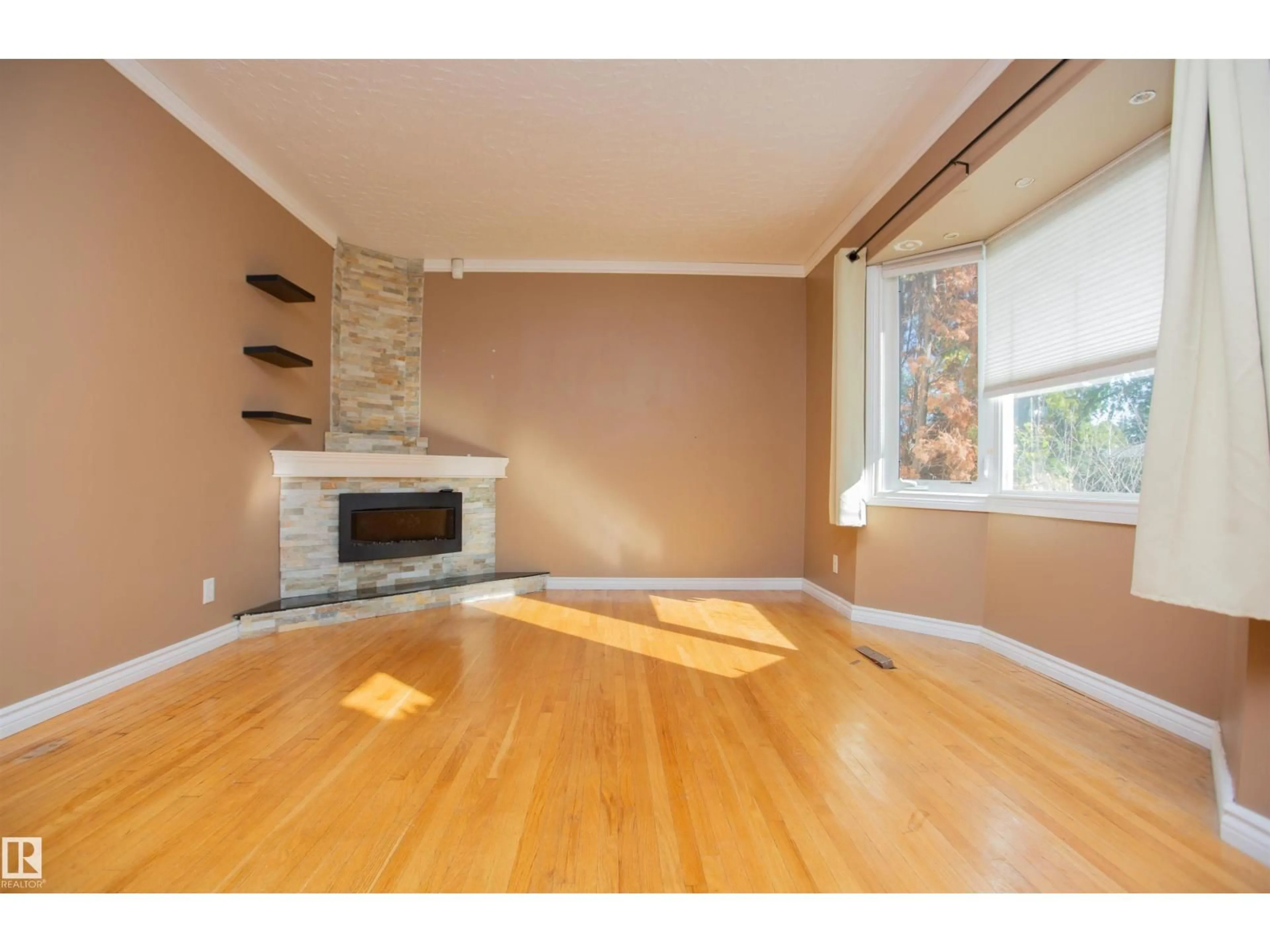 Living room with furniture, wood/laminate floor for NW - 13032 120 ST, Edmonton Alberta T5E5N9