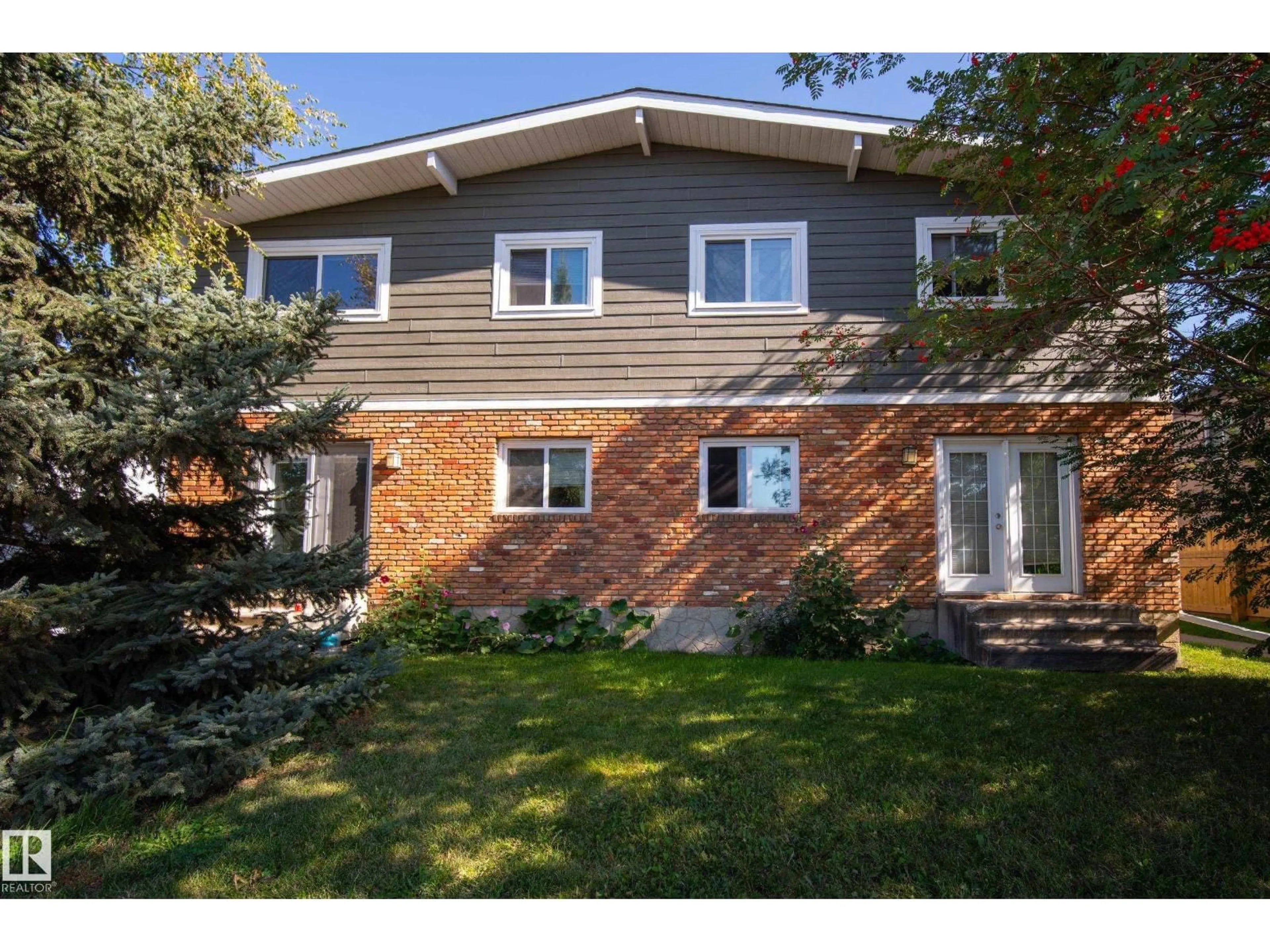 Home with brick exterior material, street for NW - 7711-7717 75 ST, Edmonton Alberta T6C2G2