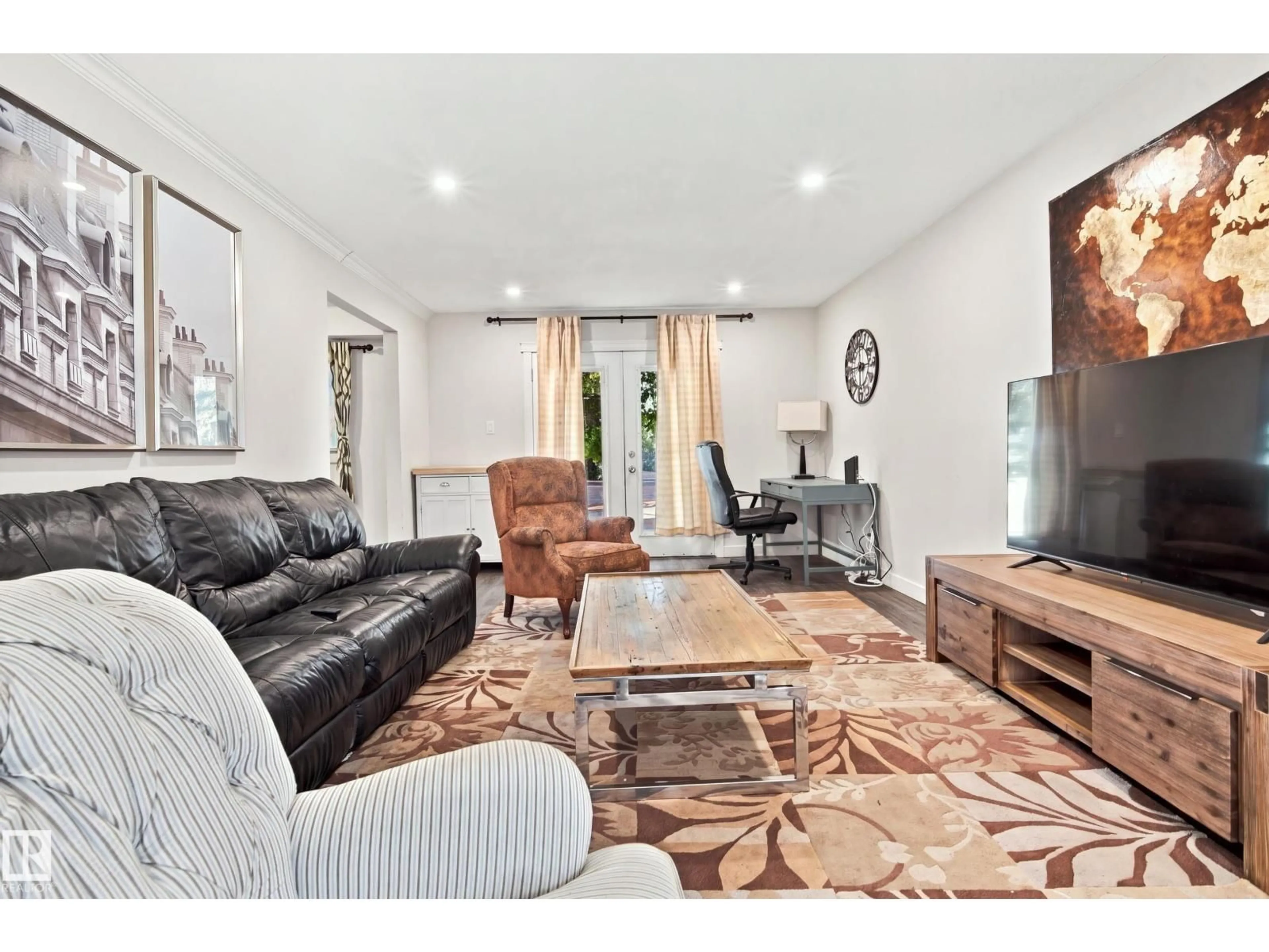 Living room with furniture, unknown for NW - 7711-7717 75 ST, Edmonton Alberta T6C2G2