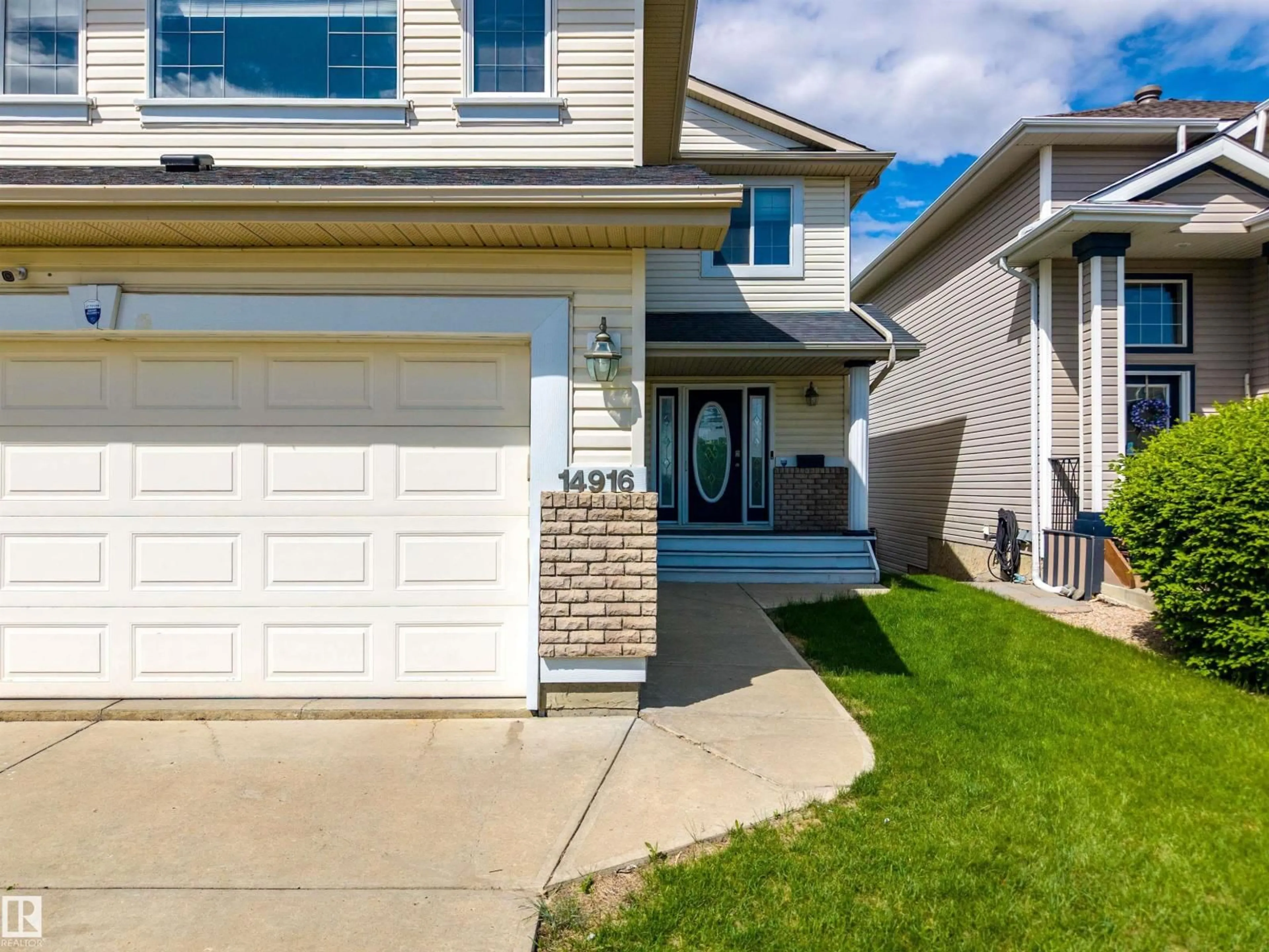 Home with vinyl exterior material, street for NW - 14916 136 ST, Edmonton Alberta T6V1M3