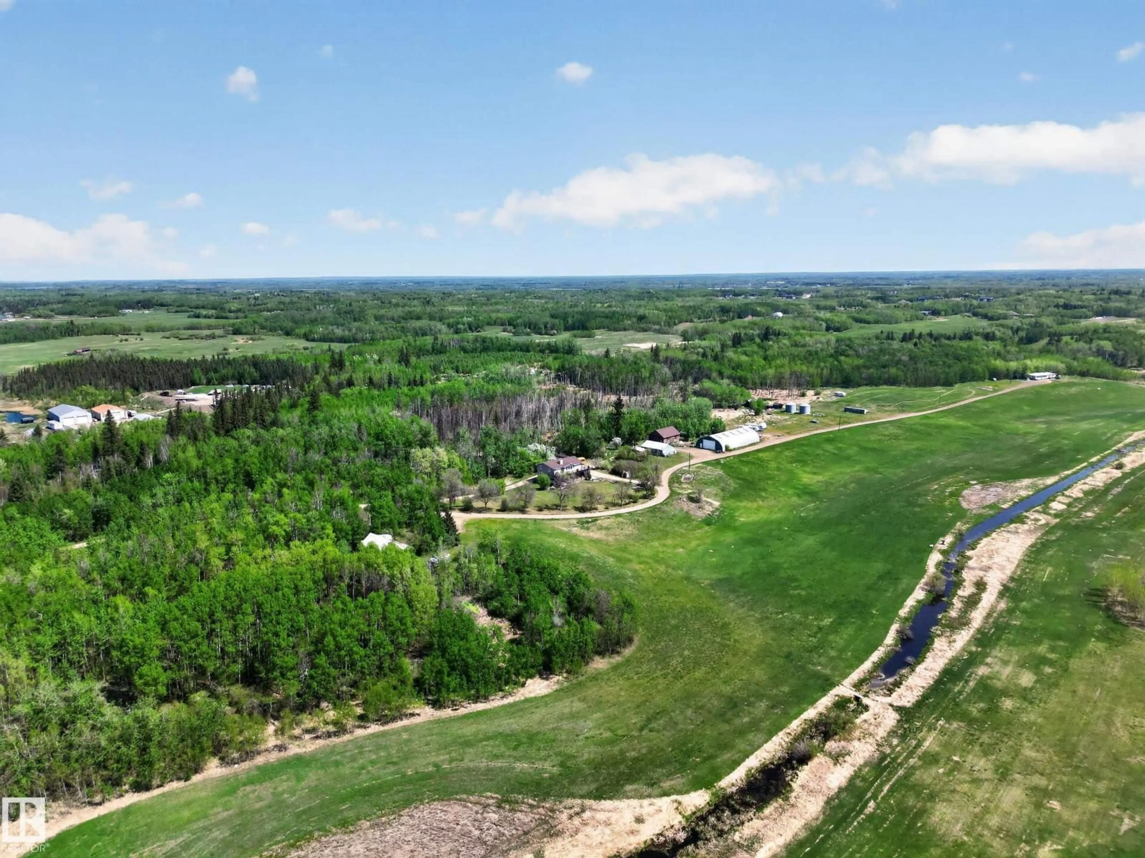 A pic from outside/outdoor area/front of a property/back of a property/a pic from drone, forest/trees view for 52073 HWY 21, Rural Strathcona County Alberta T8B1J4