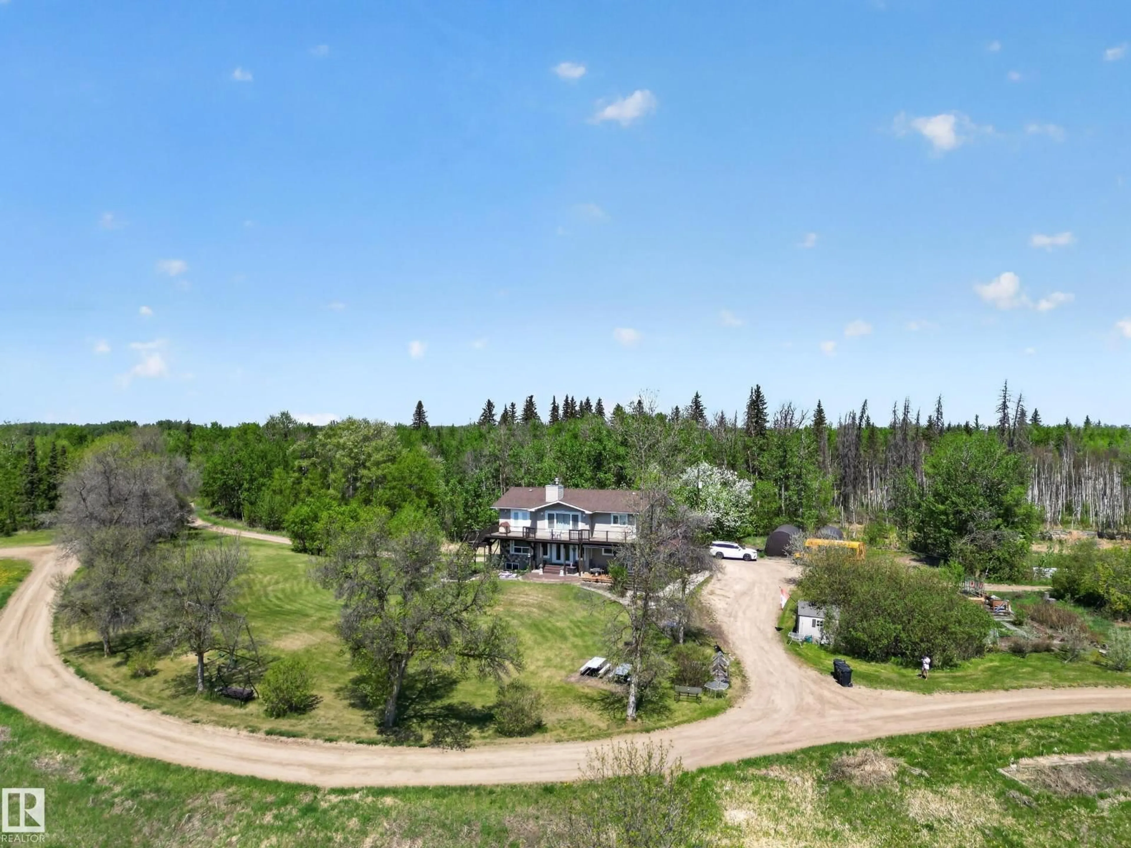 A pic from outside/outdoor area/front of a property/back of a property/a pic from drone, forest/trees view for 52073 HWY 21, Rural Strathcona County Alberta T8B1J4