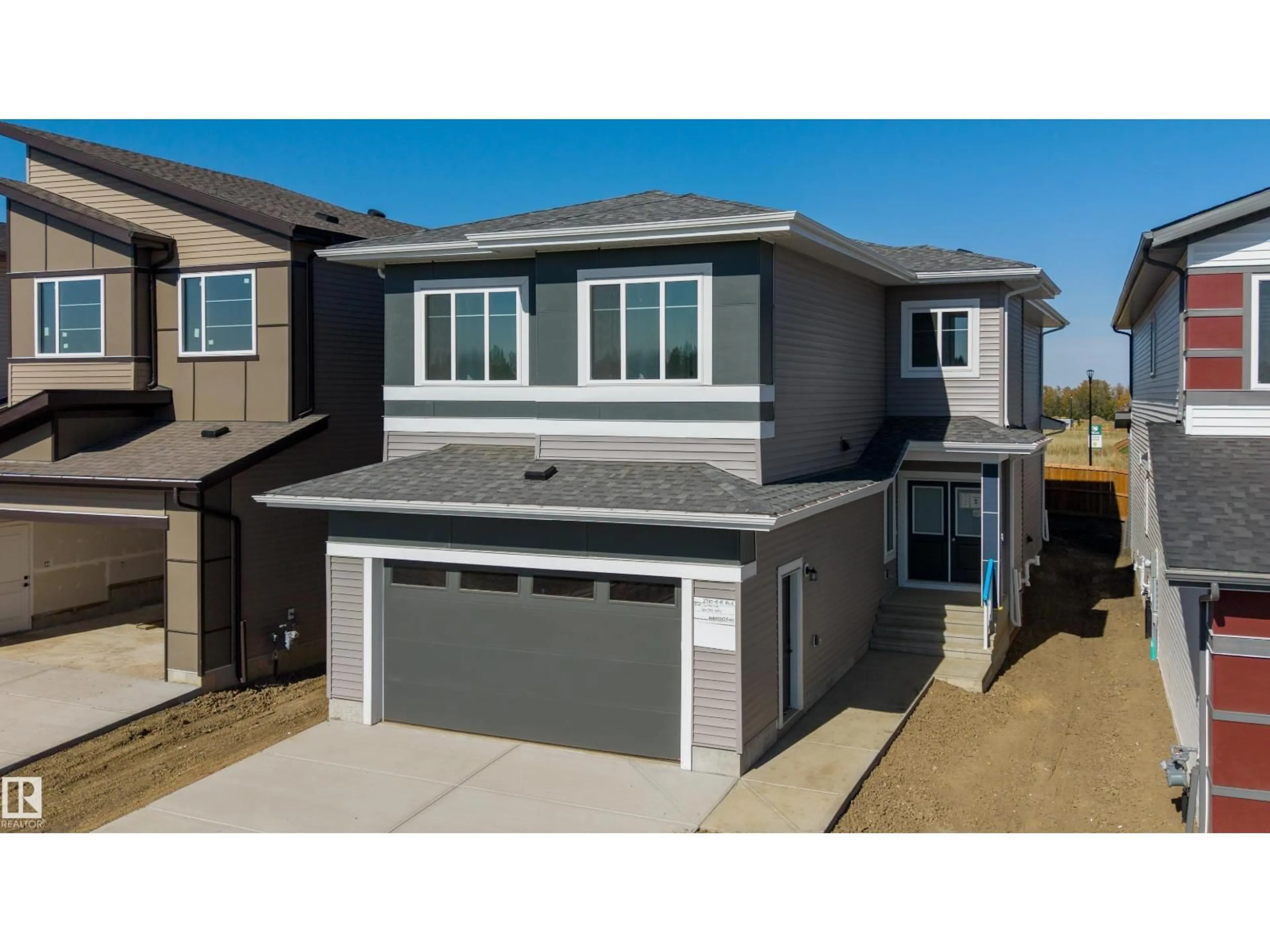 Home with vinyl exterior material, street for 2310 6A AV, Edmonton Alberta T6X3P4