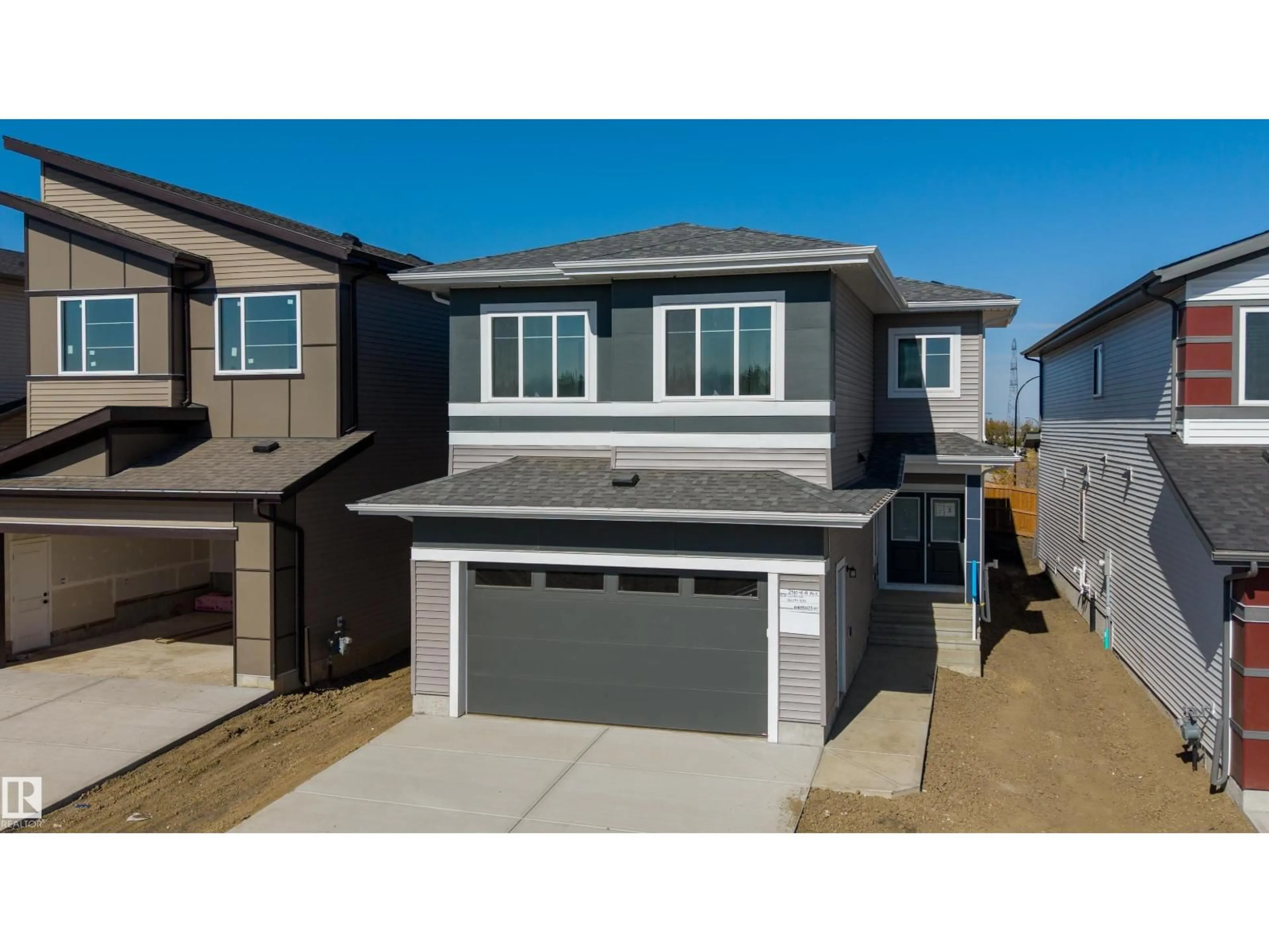 Home with vinyl exterior material, street for 2310 6A AV, Edmonton Alberta T6X3P4