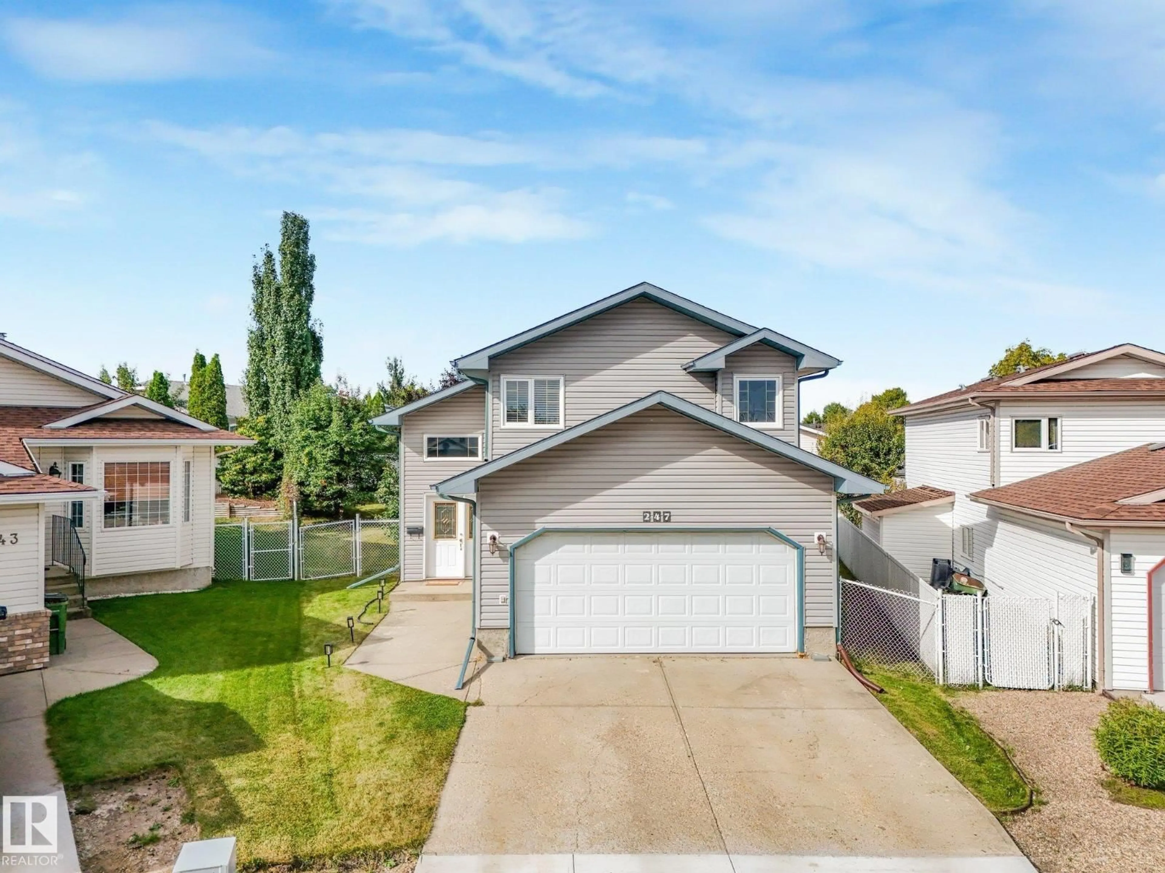 Home with vinyl exterior material, street for 247 HOOPER CR, Edmonton Alberta T5A4Z1