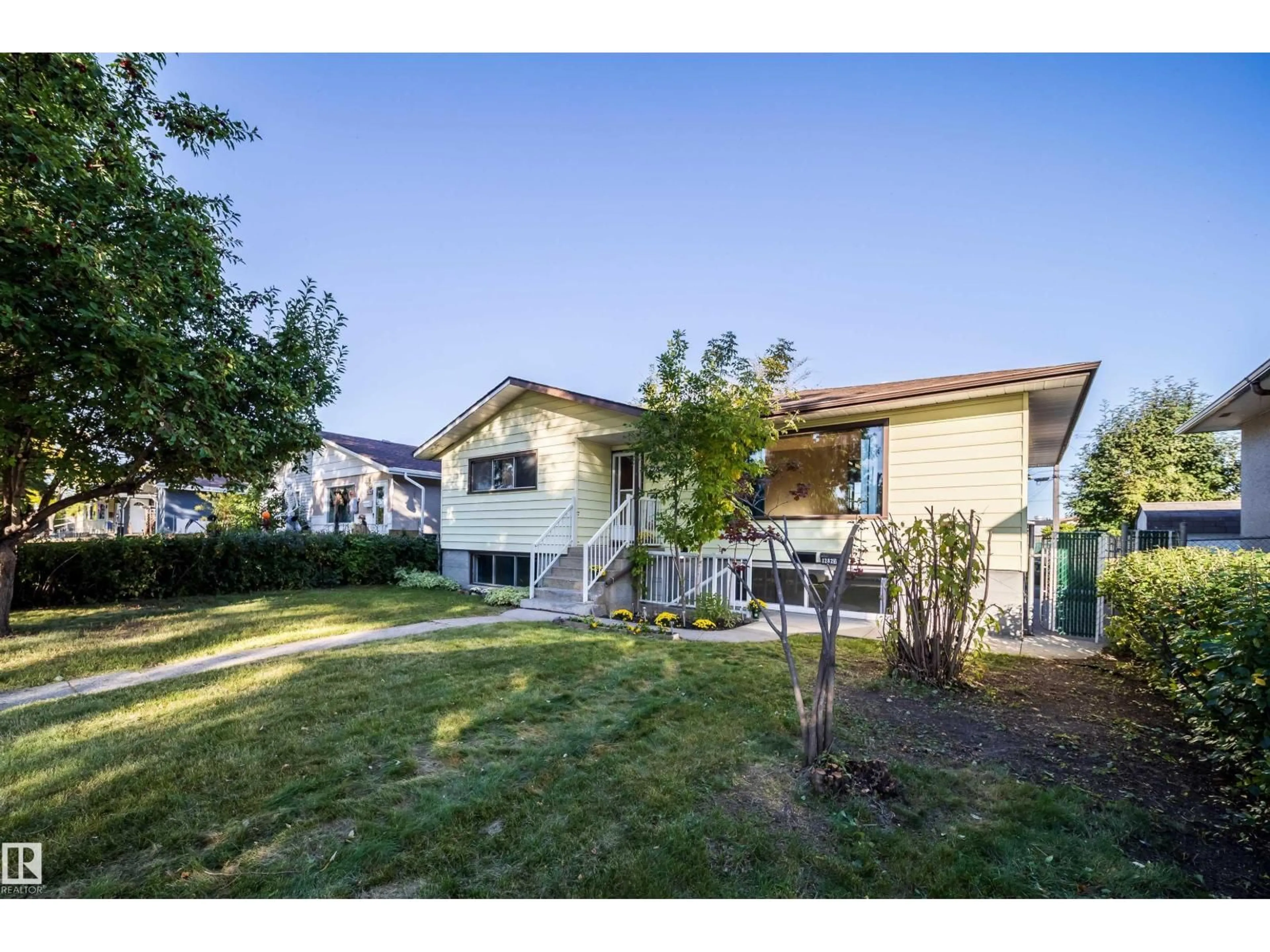 A pic from outside/outdoor area/front of a property/back of a property/a pic from drone, street for 12825 102 ST, Edmonton Alberta T5E4J2