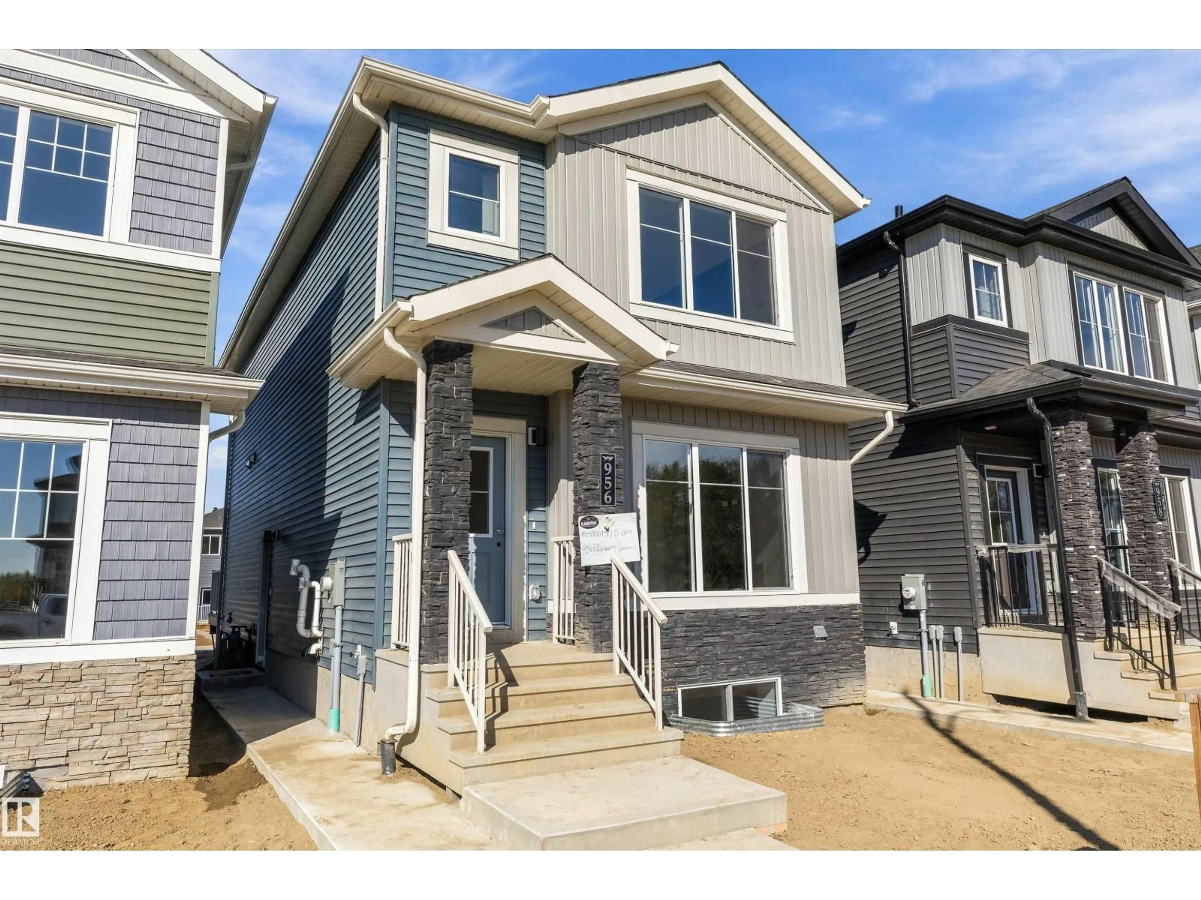 Home with vinyl exterior material, street for 956 ELDERBERRY LD, Edmonton Alberta T6M3K3