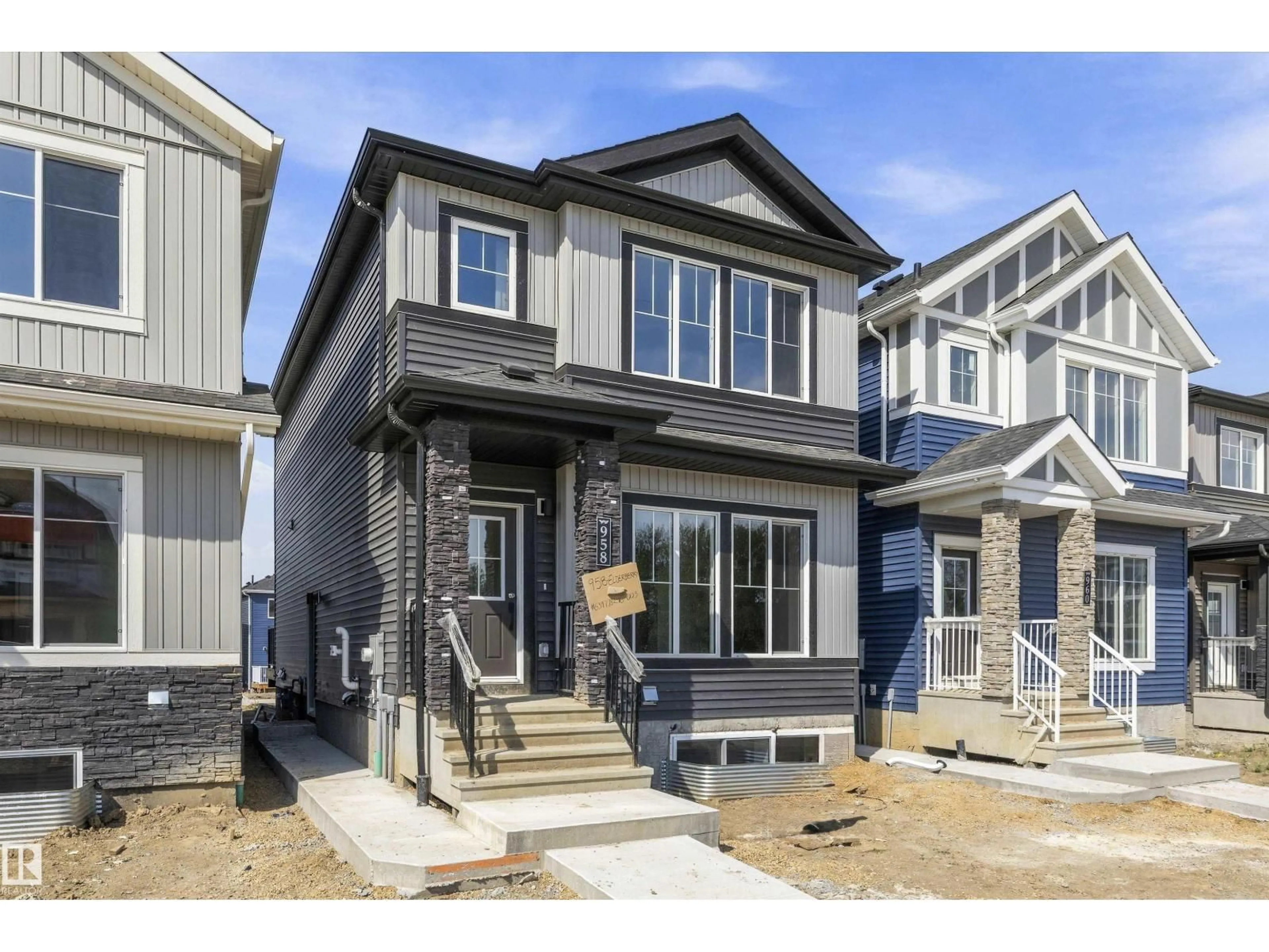Home with vinyl exterior material, street for 958 ELDERBERRY LD, Edmonton Alberta T6M3K3