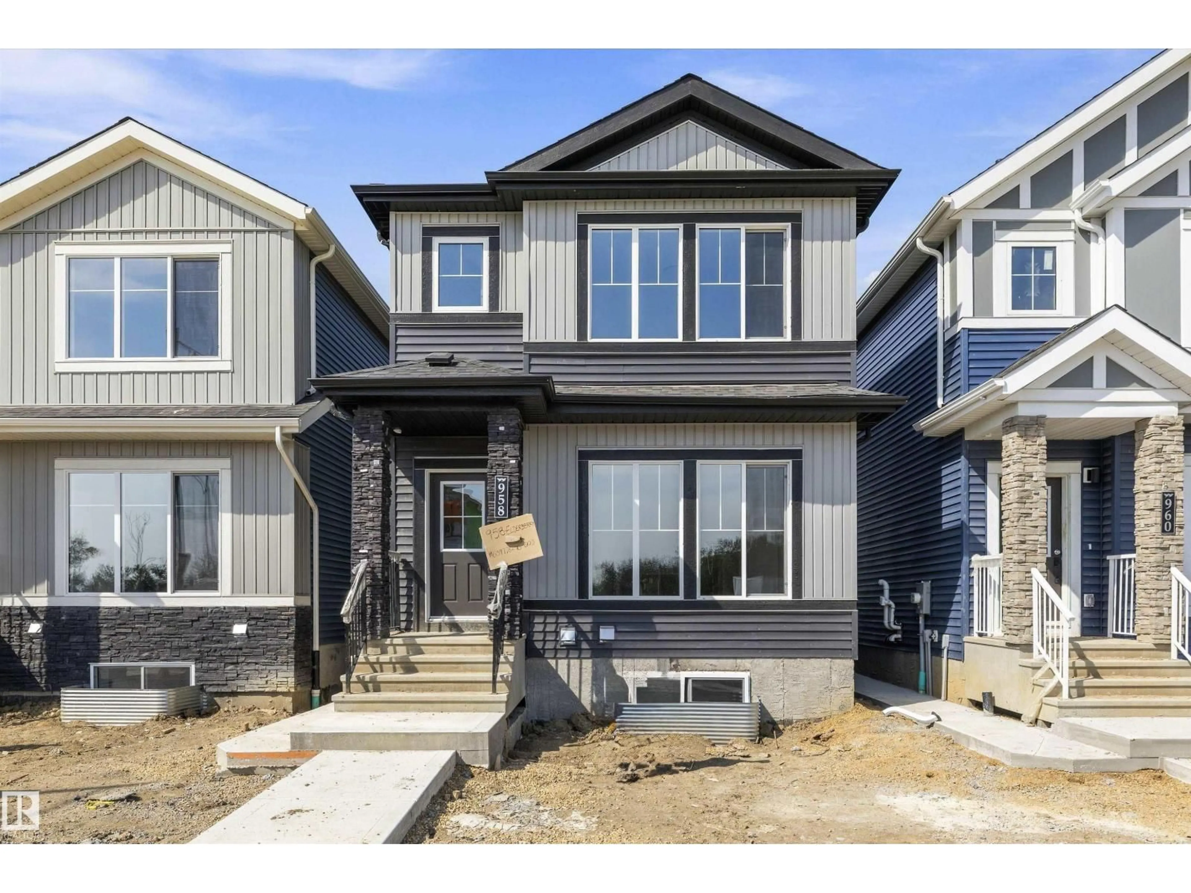 Home with vinyl exterior material, street for 958 ELDERBERRY LD, Edmonton Alberta T6M3K3