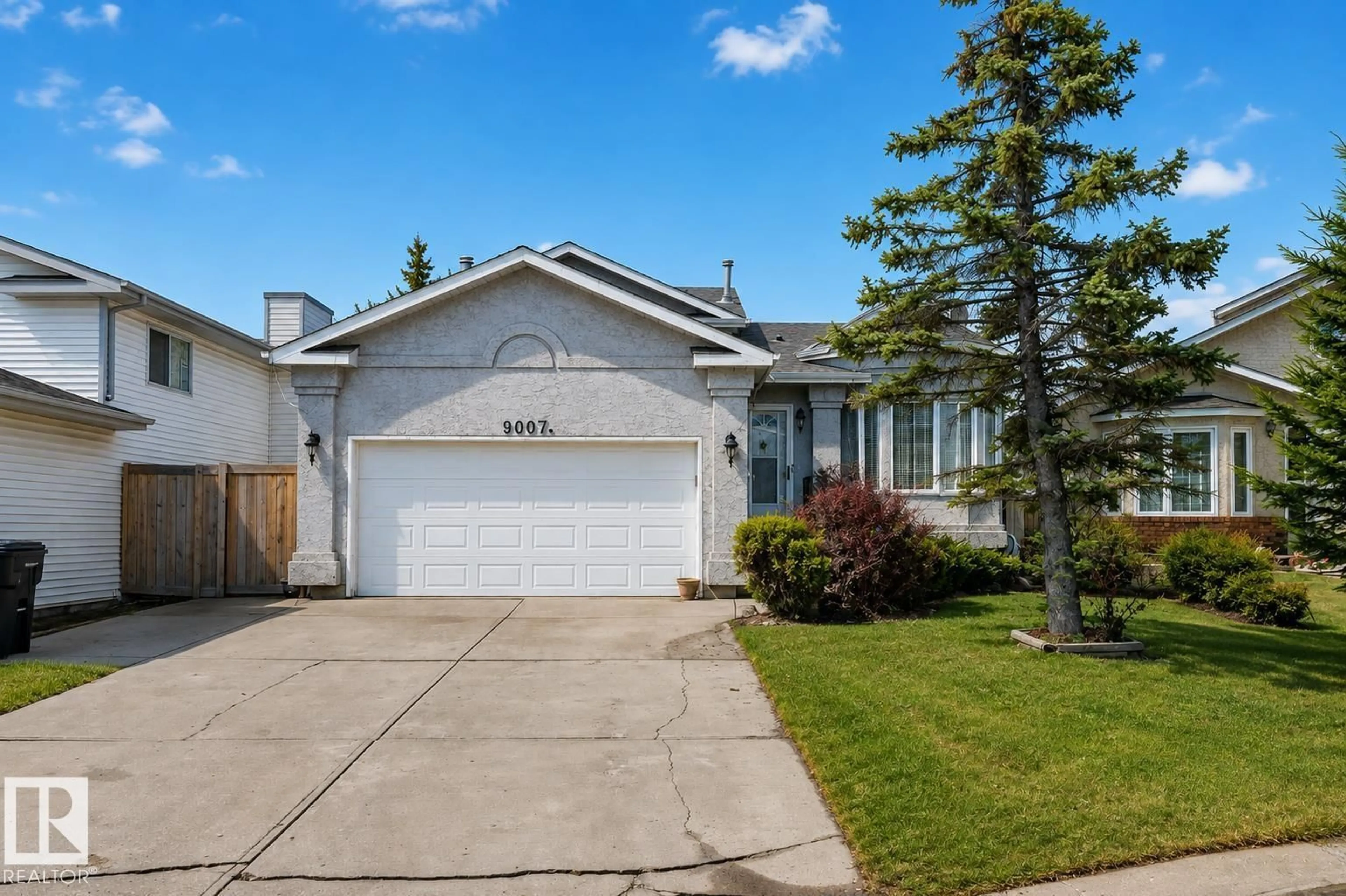 Home with vinyl exterior material, street for NW - 9007 169 AV, Edmonton Alberta T5Z2X5