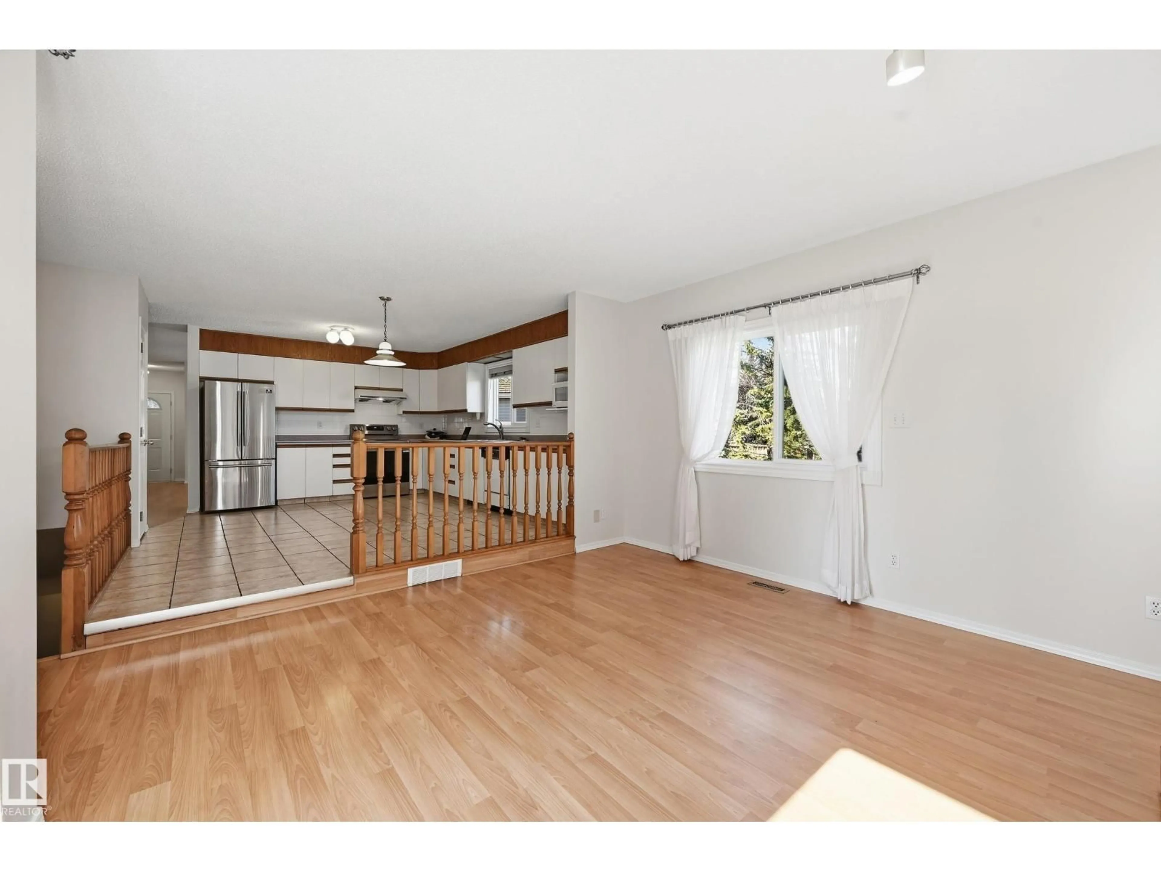 Open concept kitchen, wood/laminate floor for 11102 11A AV, Edmonton Alberta T6J6R9