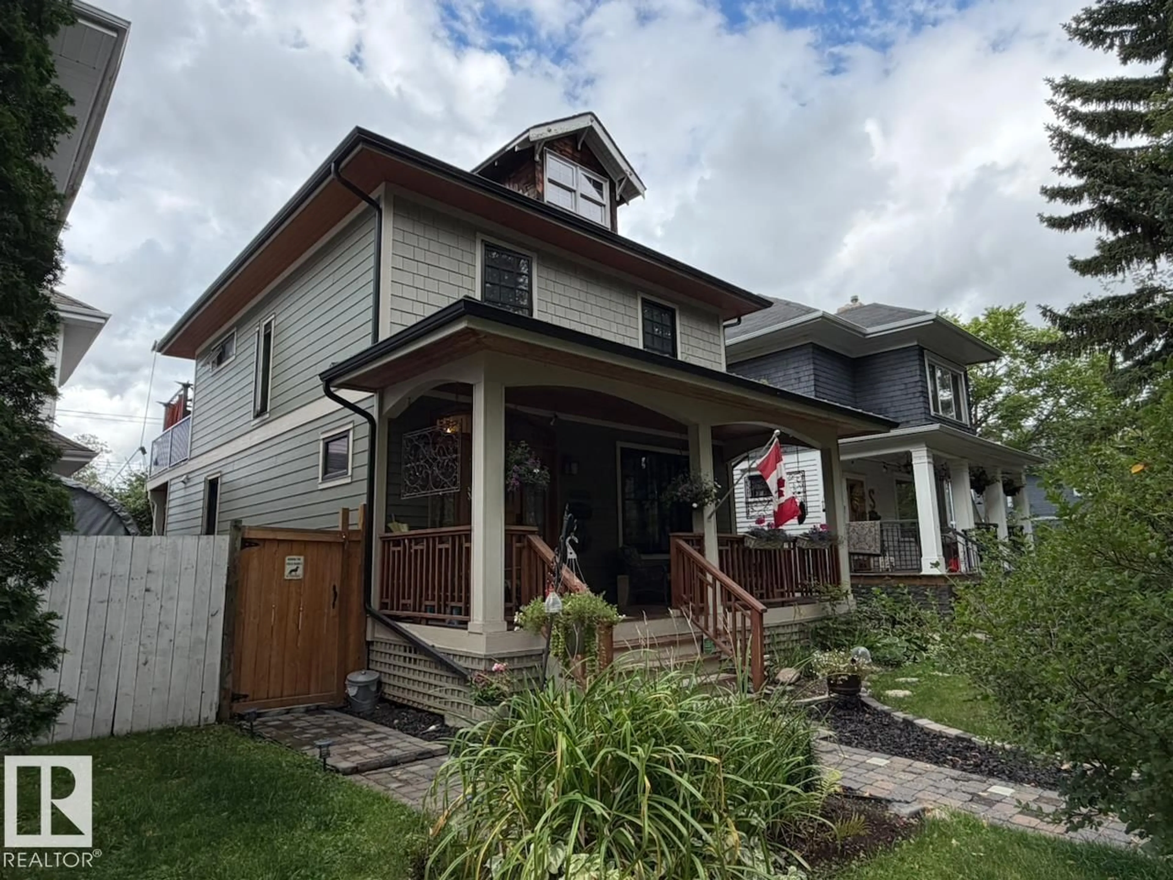 Home with vinyl exterior material, street for 10994 126 ST, Edmonton Alberta T5M0P5