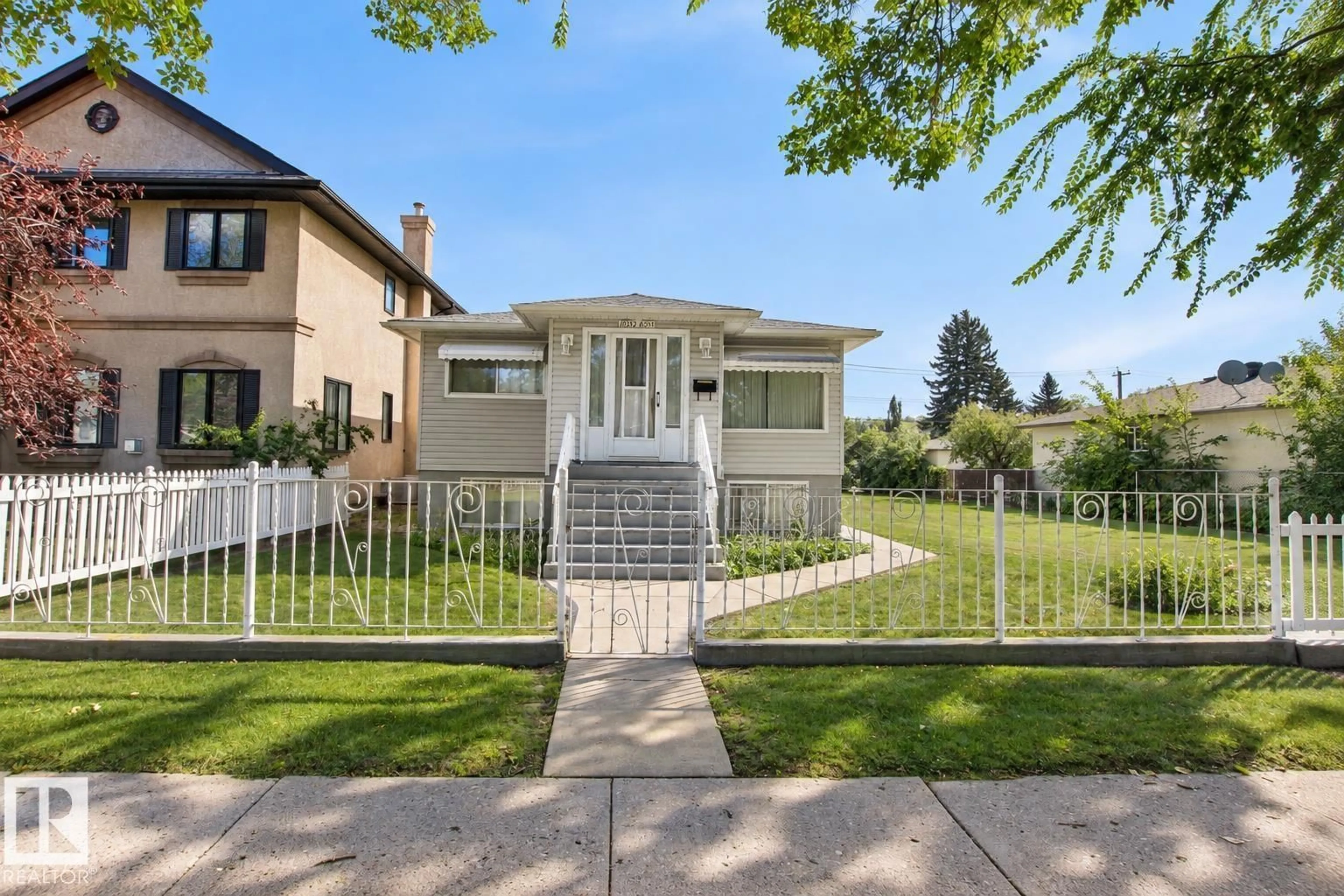 Home with vinyl exterior material, street for 10339 80 STREET NW, Edmonton Alberta T6A3J3