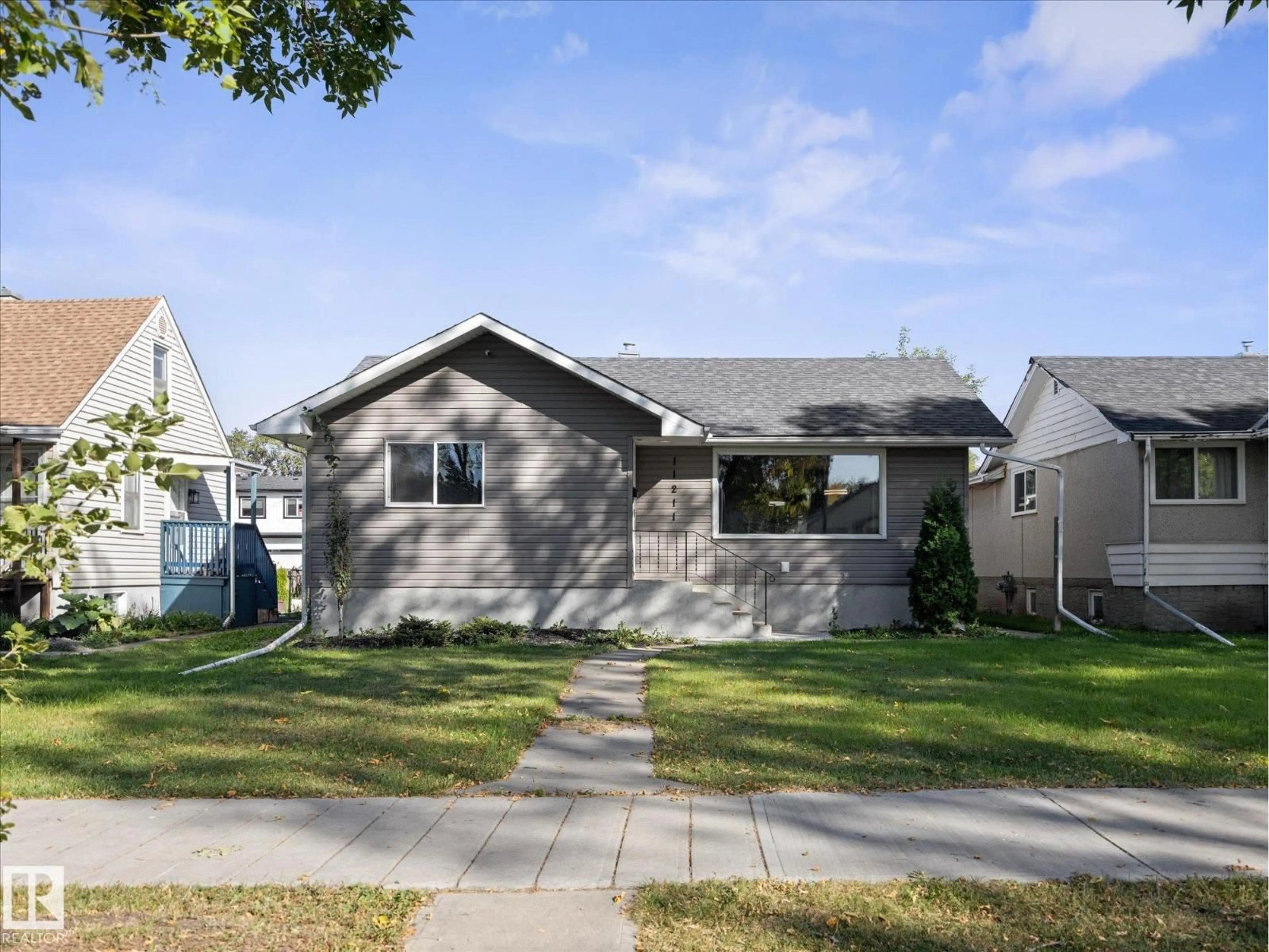 Home with vinyl exterior material, street for NW - 11211 104 ST, Edmonton Alberta T5G2K6