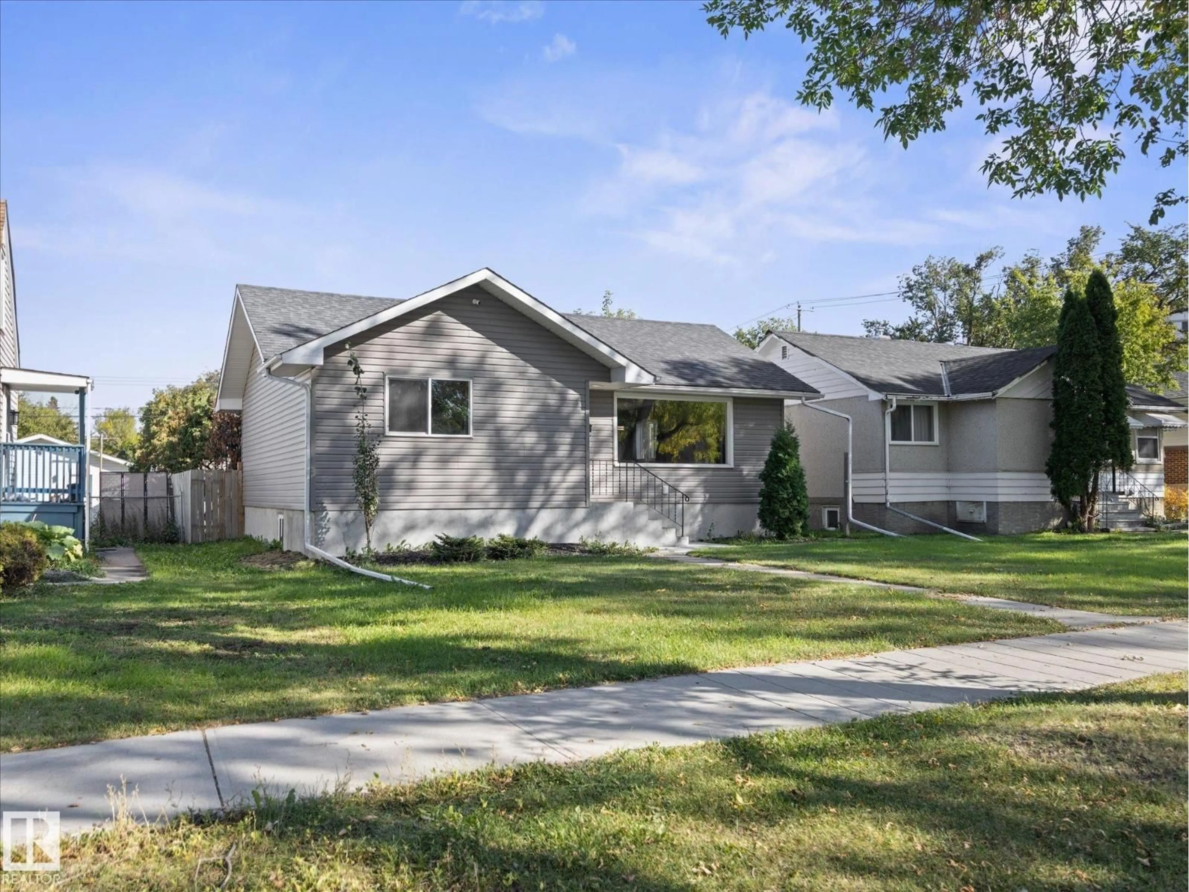 Home with vinyl exterior material, street for NW - 11211 104 ST, Edmonton Alberta T5G2K6