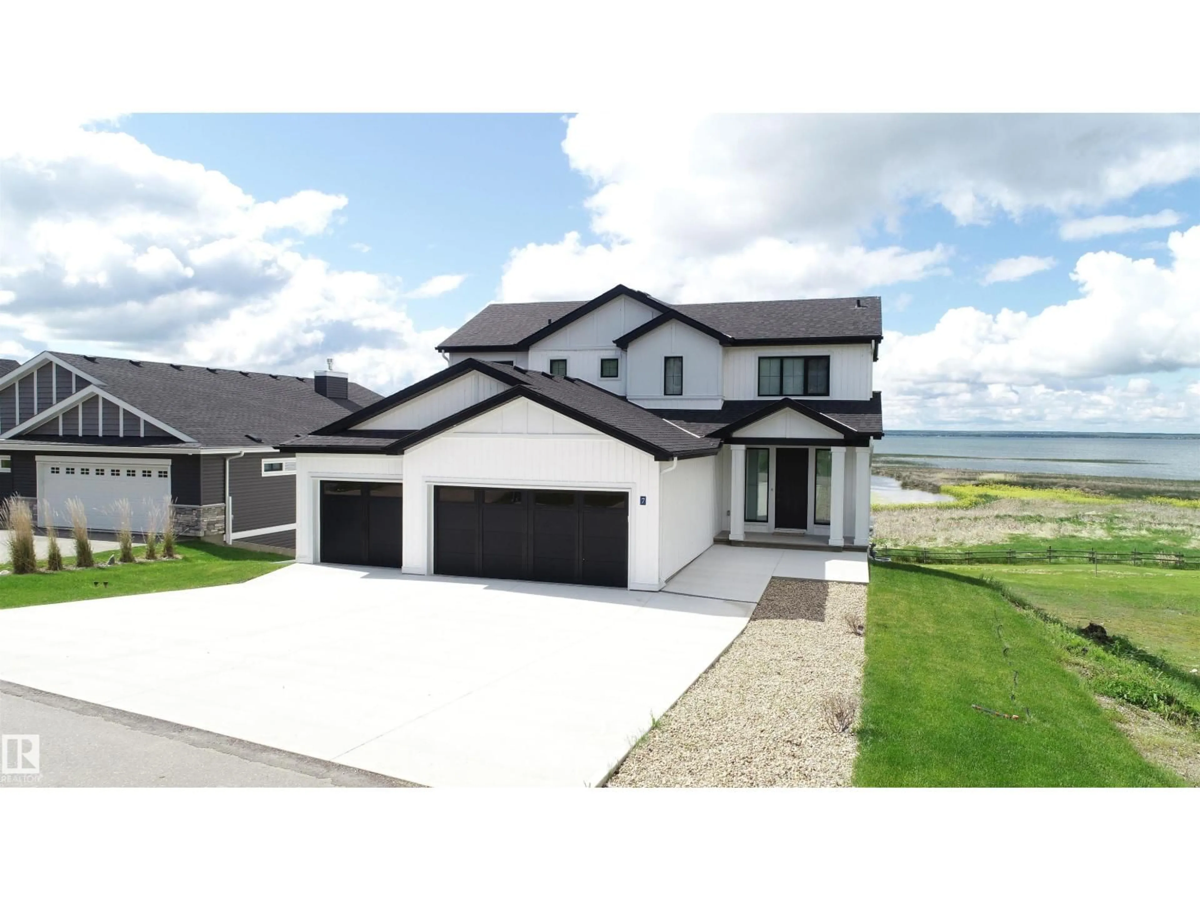 A pic from outside/outdoor area/front of a property/back of a property/a pic from drone, water/lake/river/ocean view for STE. - 7 ANNE TR, Rural Lac Ste. Anne County Alberta T0E1A1
